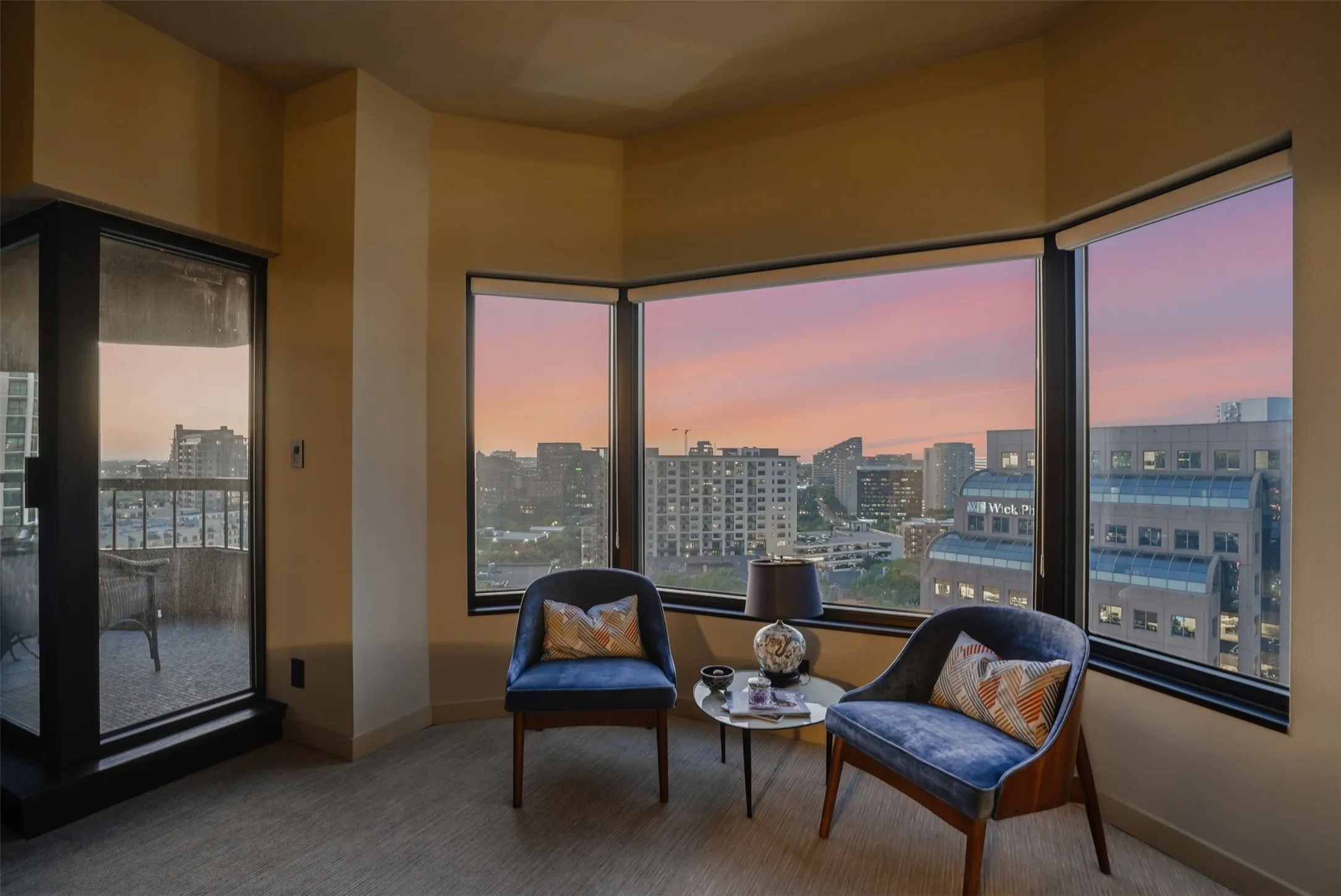 Sitting room featuring a city view, and healthy amount of natural light
