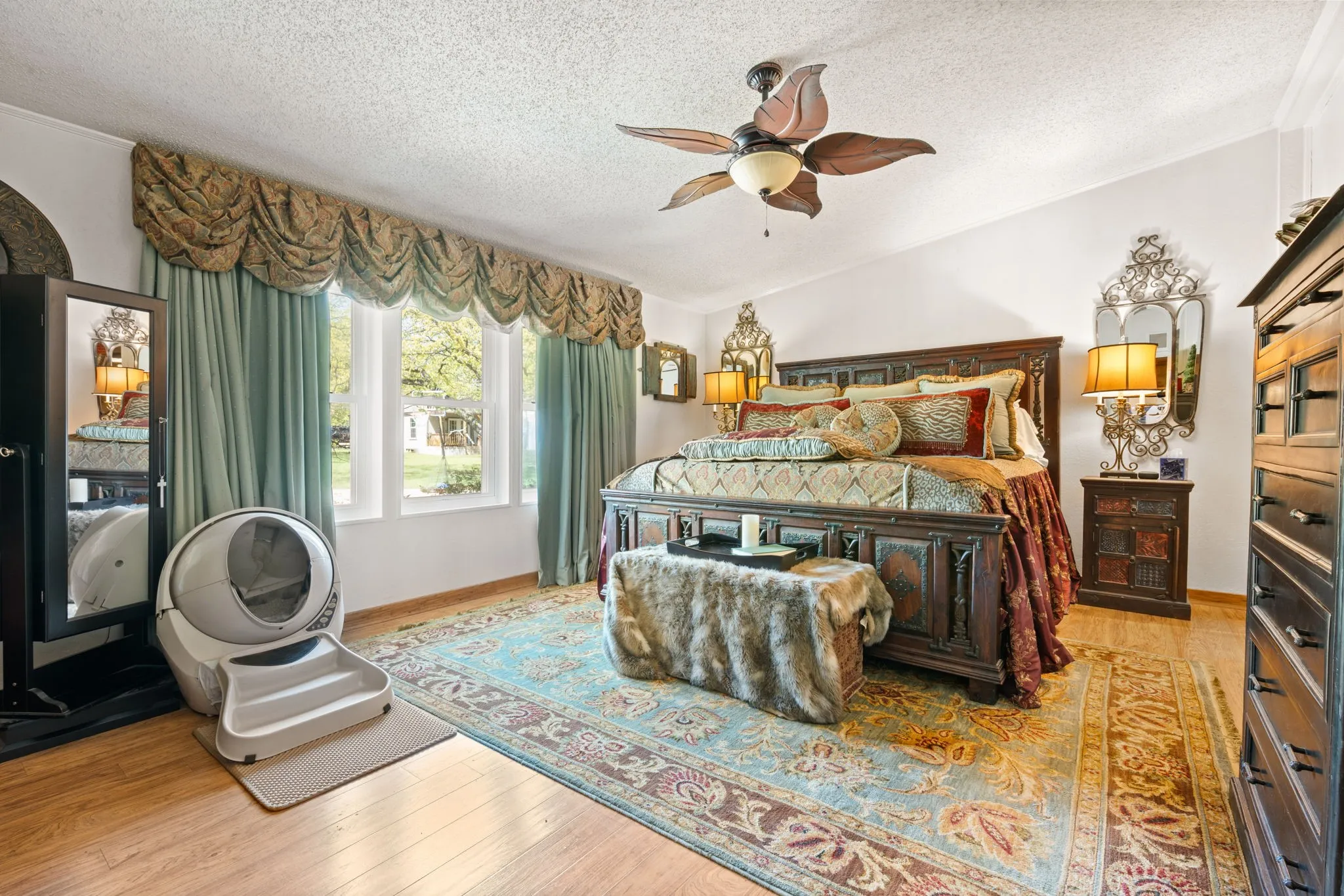 Bedroom featuring light wood finished floors and ceiling fan