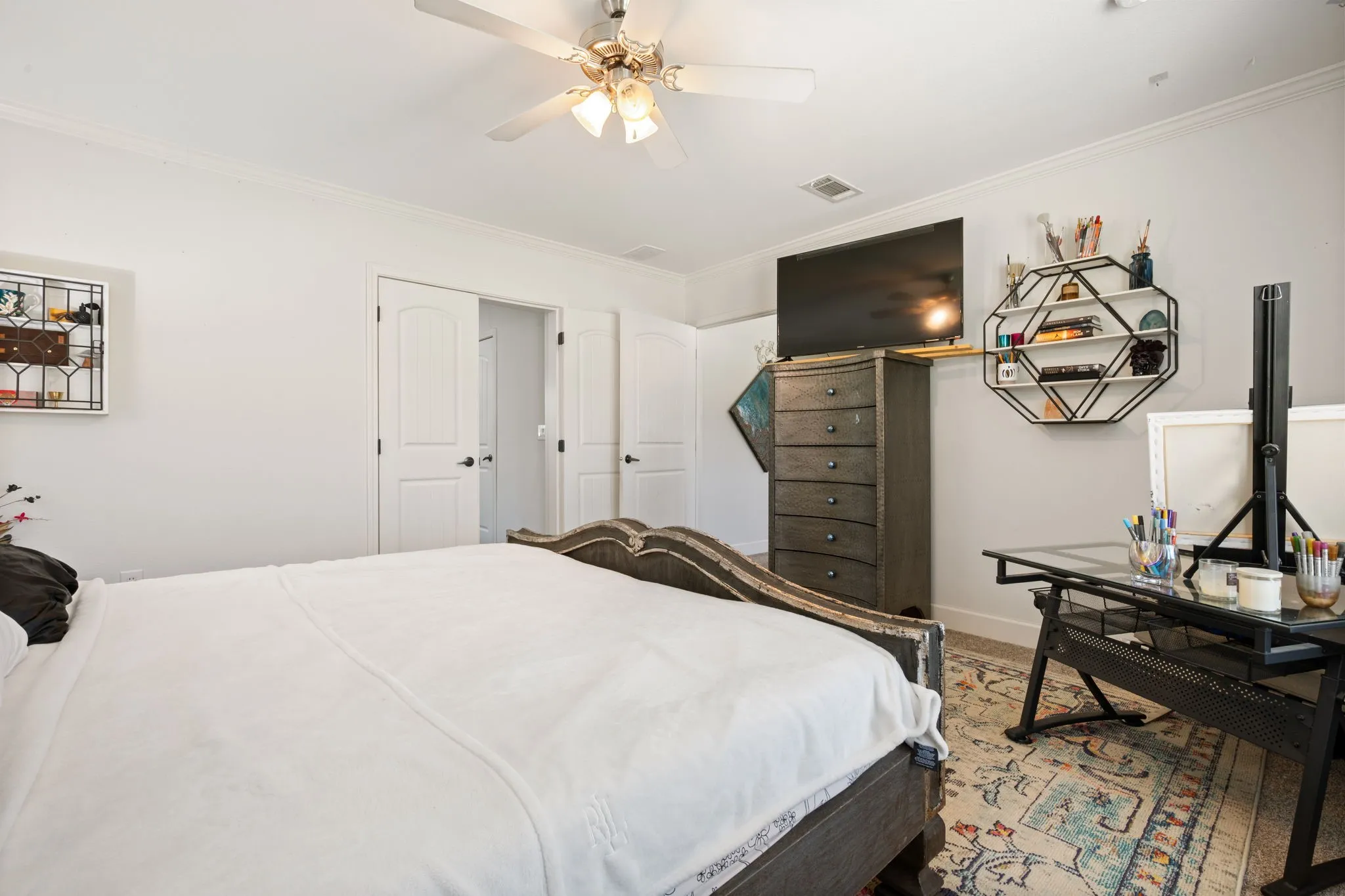 Bedroom featuring crown molding and a ceiling fan