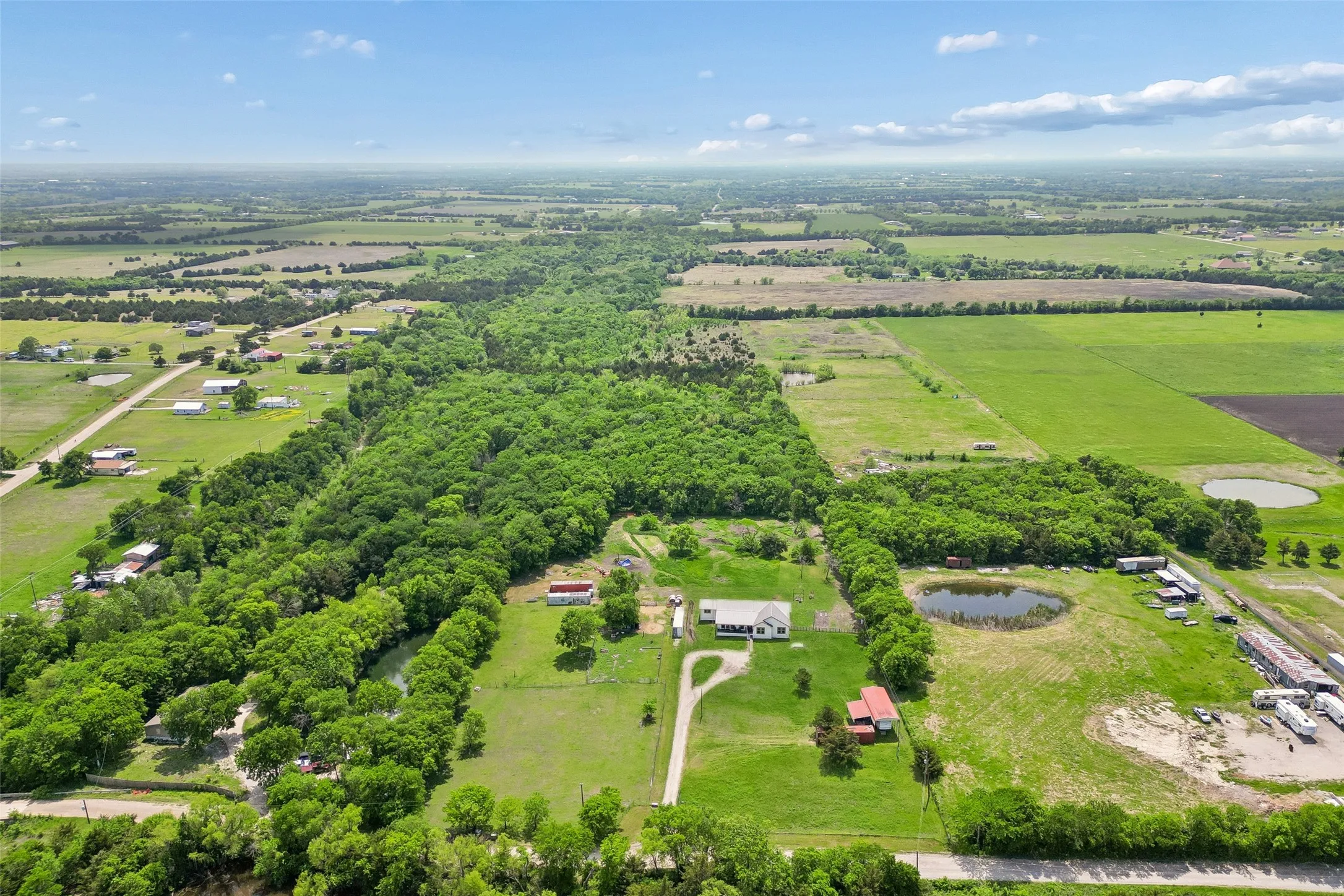 Farm For Sale in Fannin County , 579 County Road 5005, Blue Ridge, Texas 75424, 4 Bedrooms, 3 Bathrooms, Garage spaces, 2,900 Sqft, built in 2020, Preowned, Price $1,150,000, mls#21228401, Real Estate Agent in Blue Ridge, Homes For Sale in Fannin county, Homes For Sale in Blue Ridge, Realtor in Blue Ridge Texas, Real Estate Brokerage Independent Realty Texas, Luminita Cordes Realtor