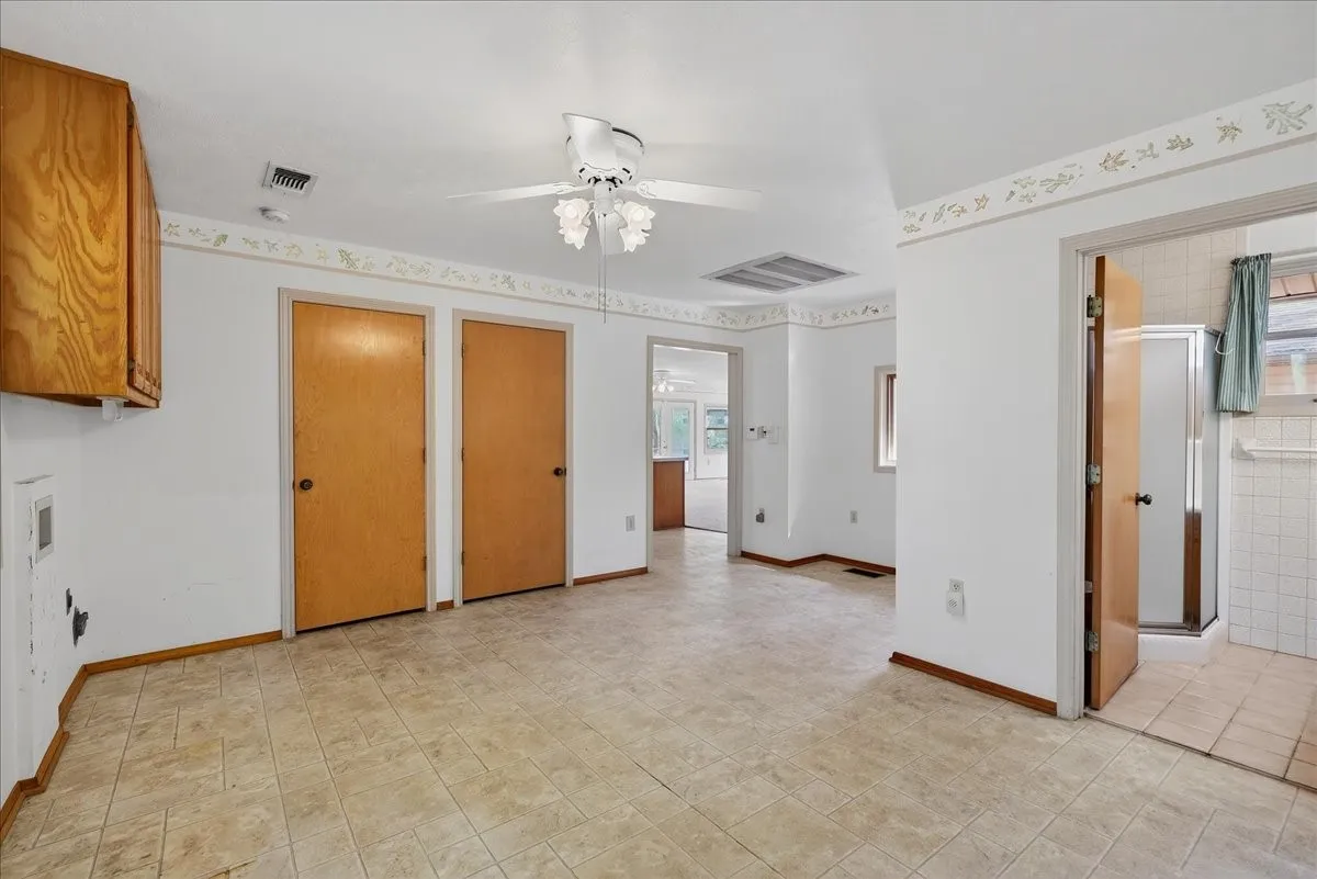 Utility room with extra full bath