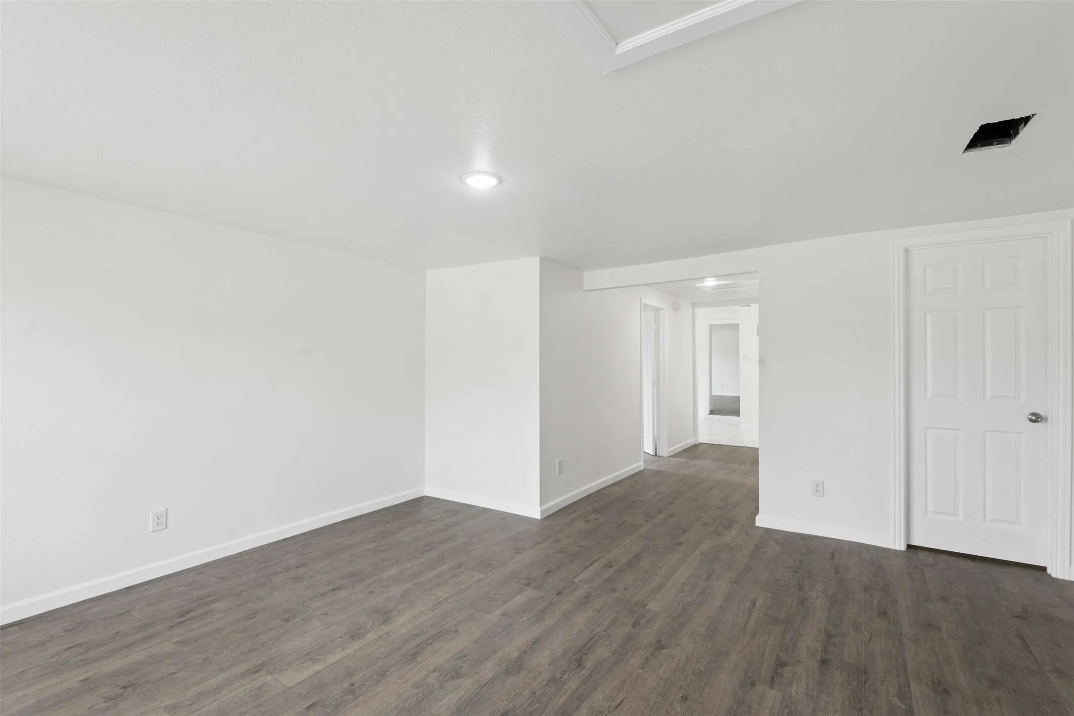 Unfurnished room featuring dark wood-type flooring