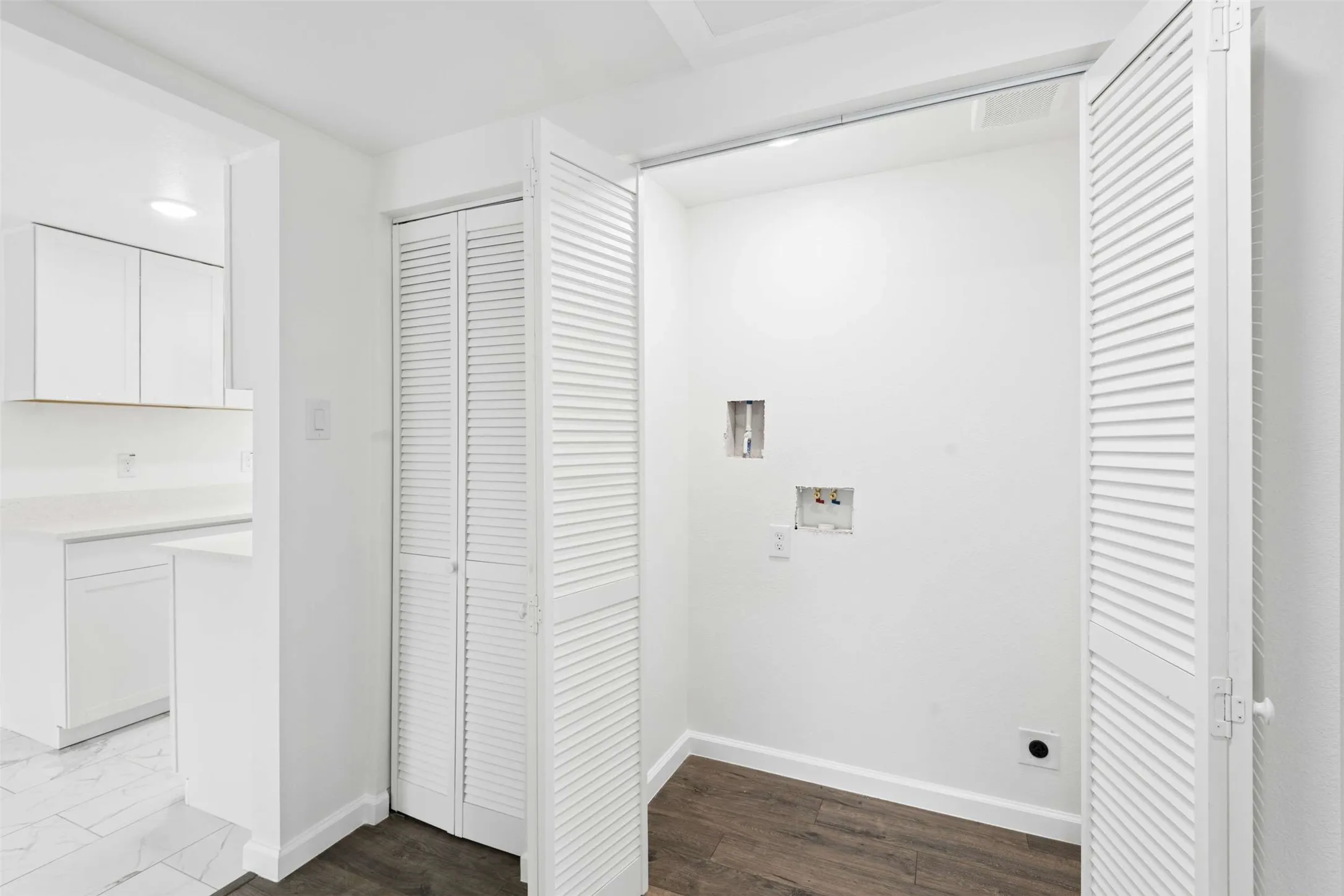 Laundry area with hookup for a washing machine and dark wood-style flooring