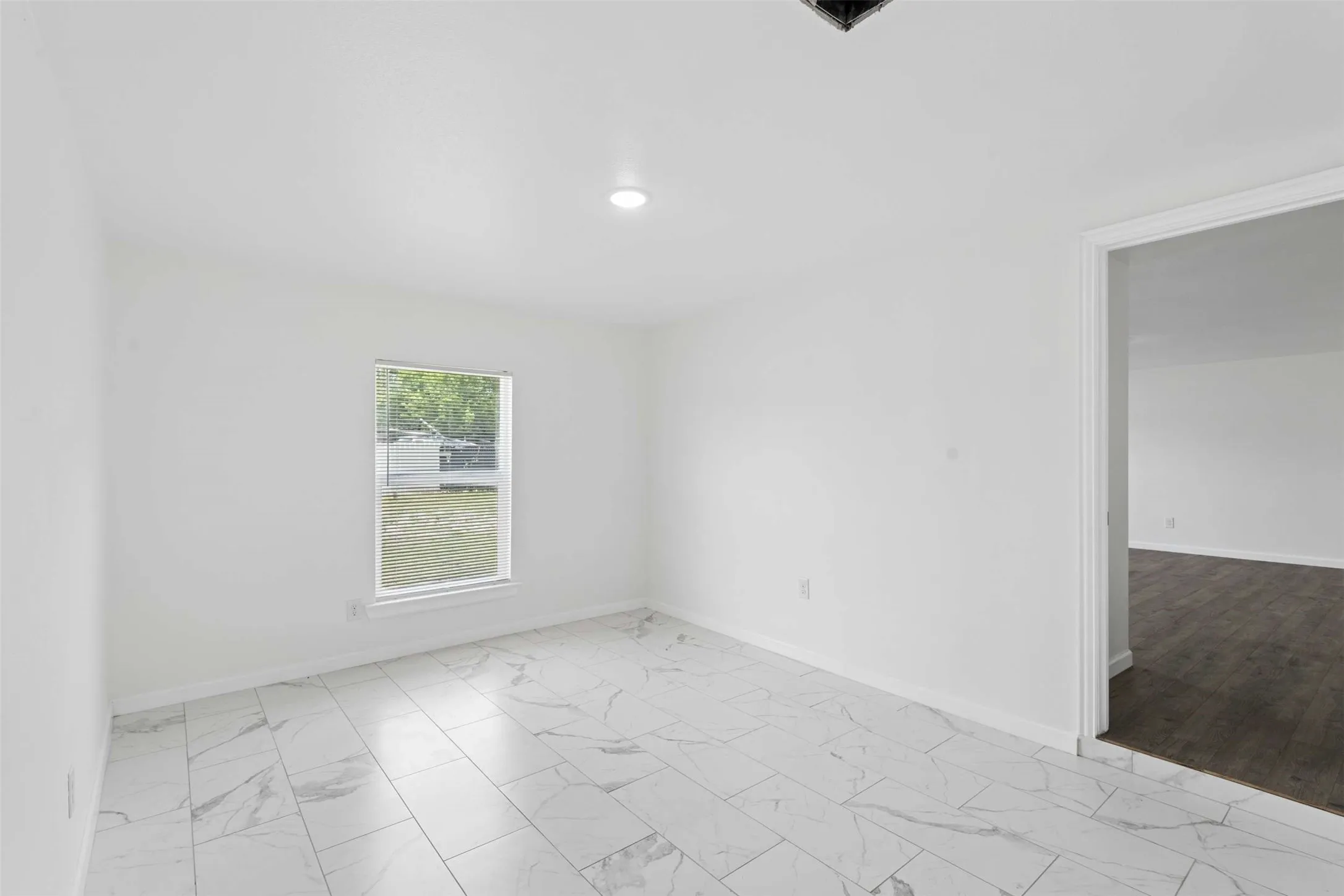 Empty room with light marble finish floors