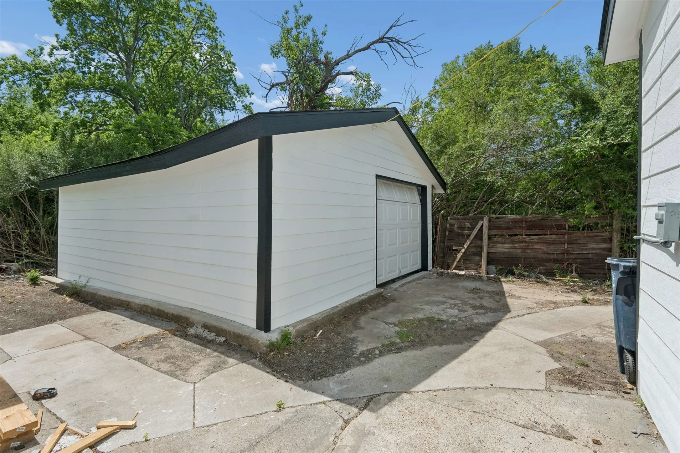 Detached garage featuring driveway