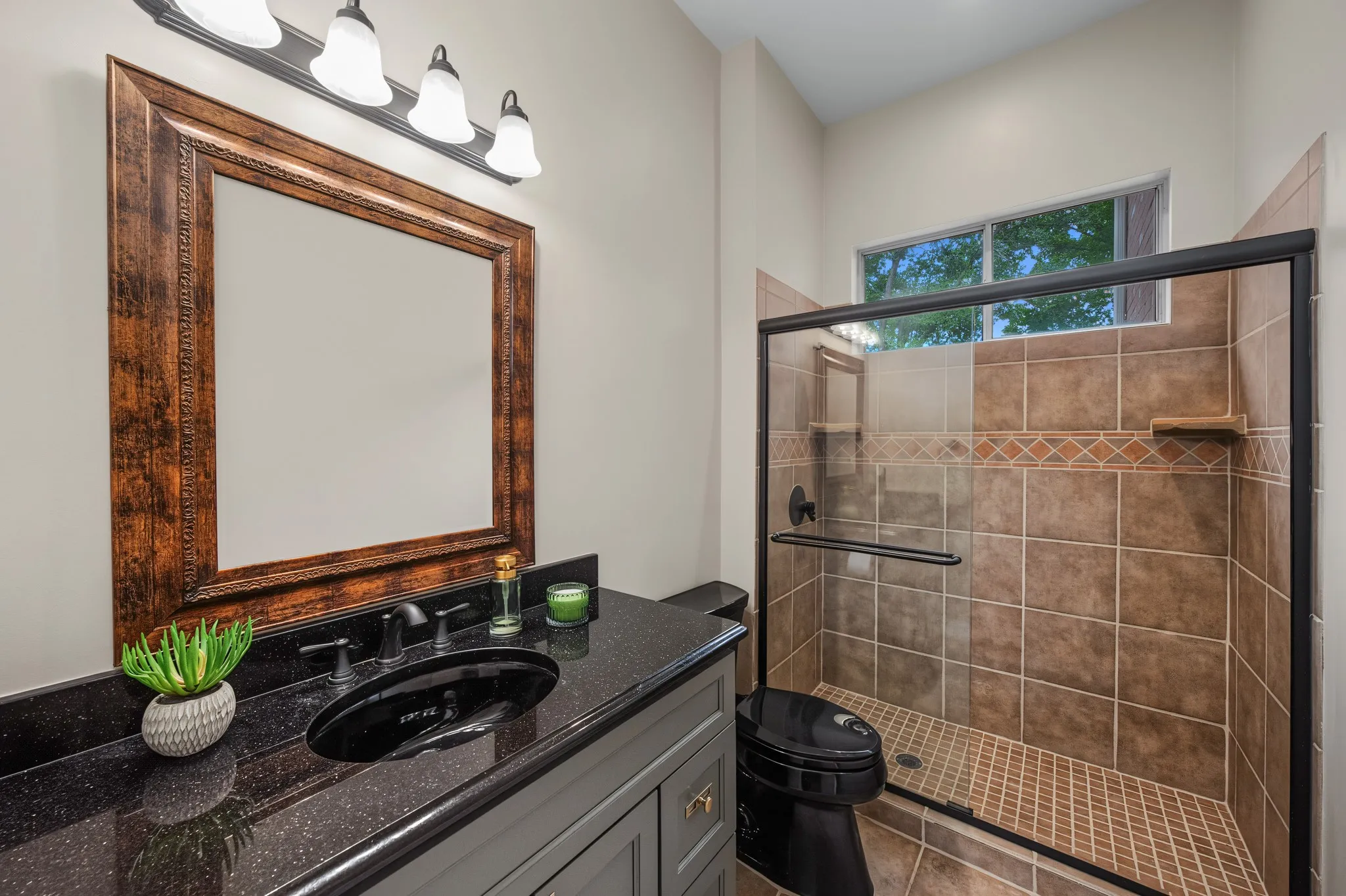 Black granite-finish countertop with an undermount sink