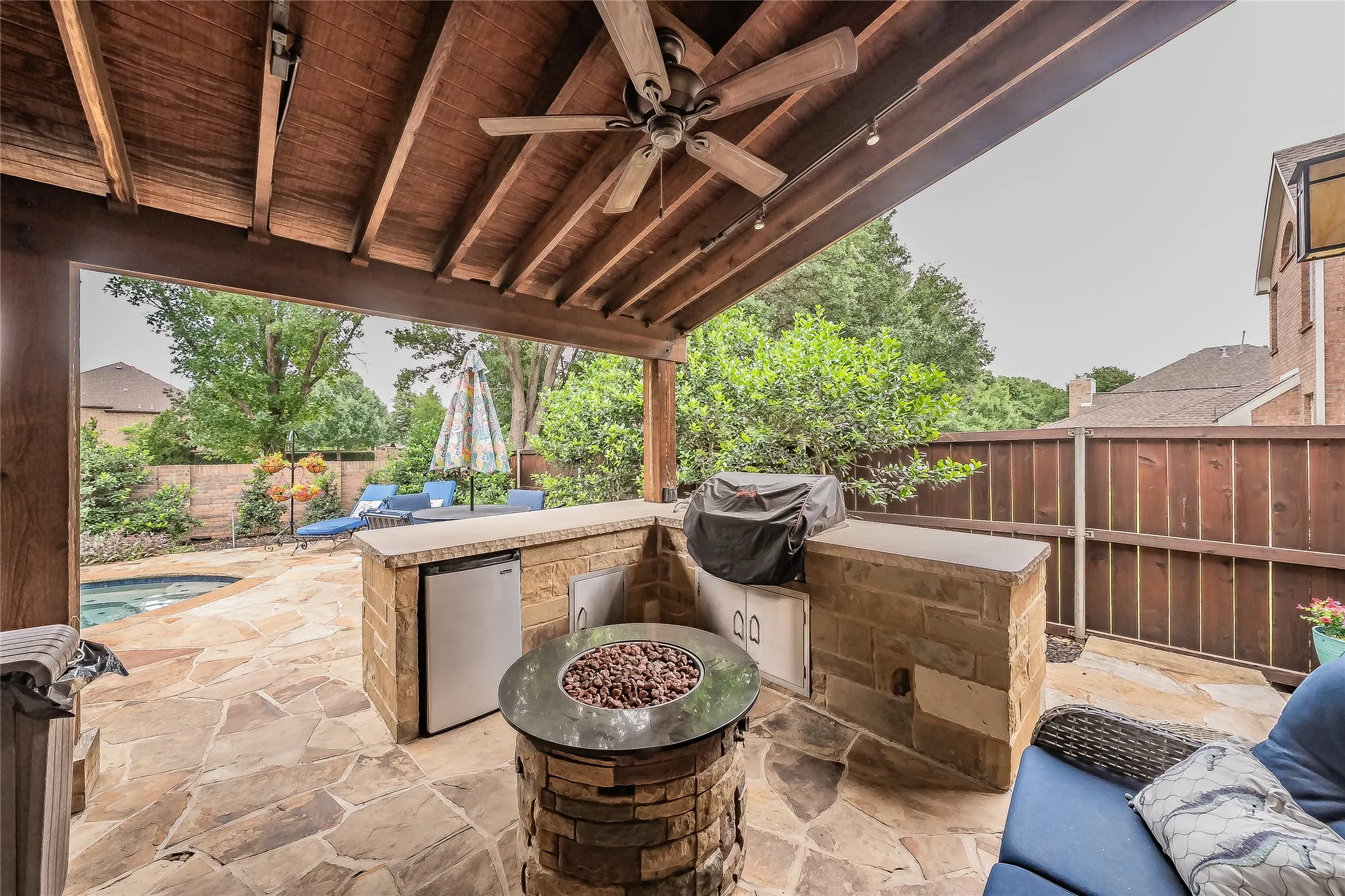 Functional covered patio extending the home's living space outdoors