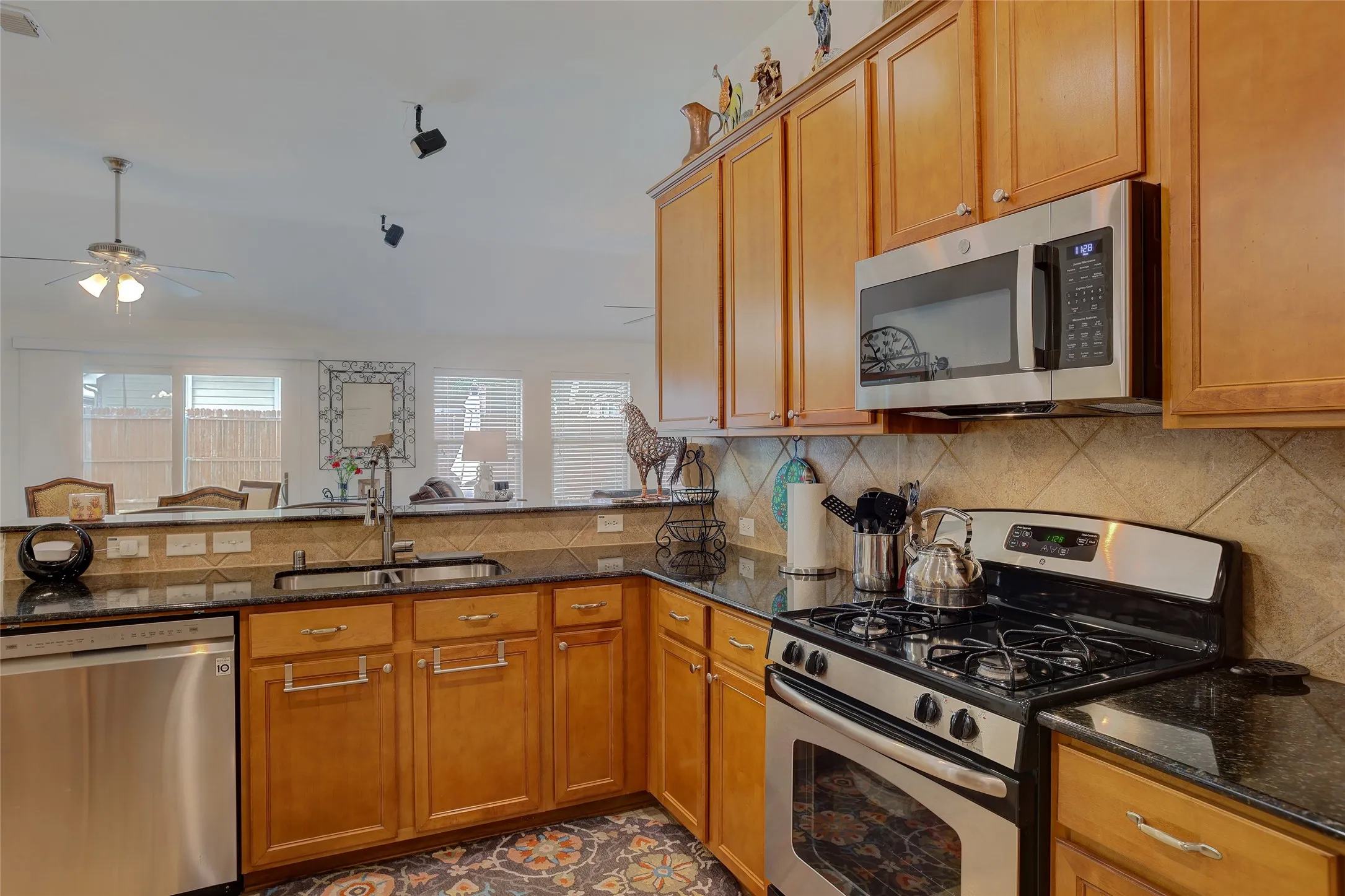 Open Kitchen with access and views of Living Room and Backyard