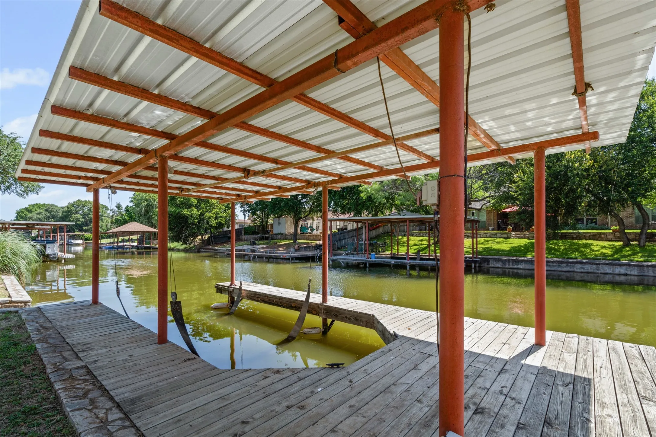 Dock with a water view and boat lift
