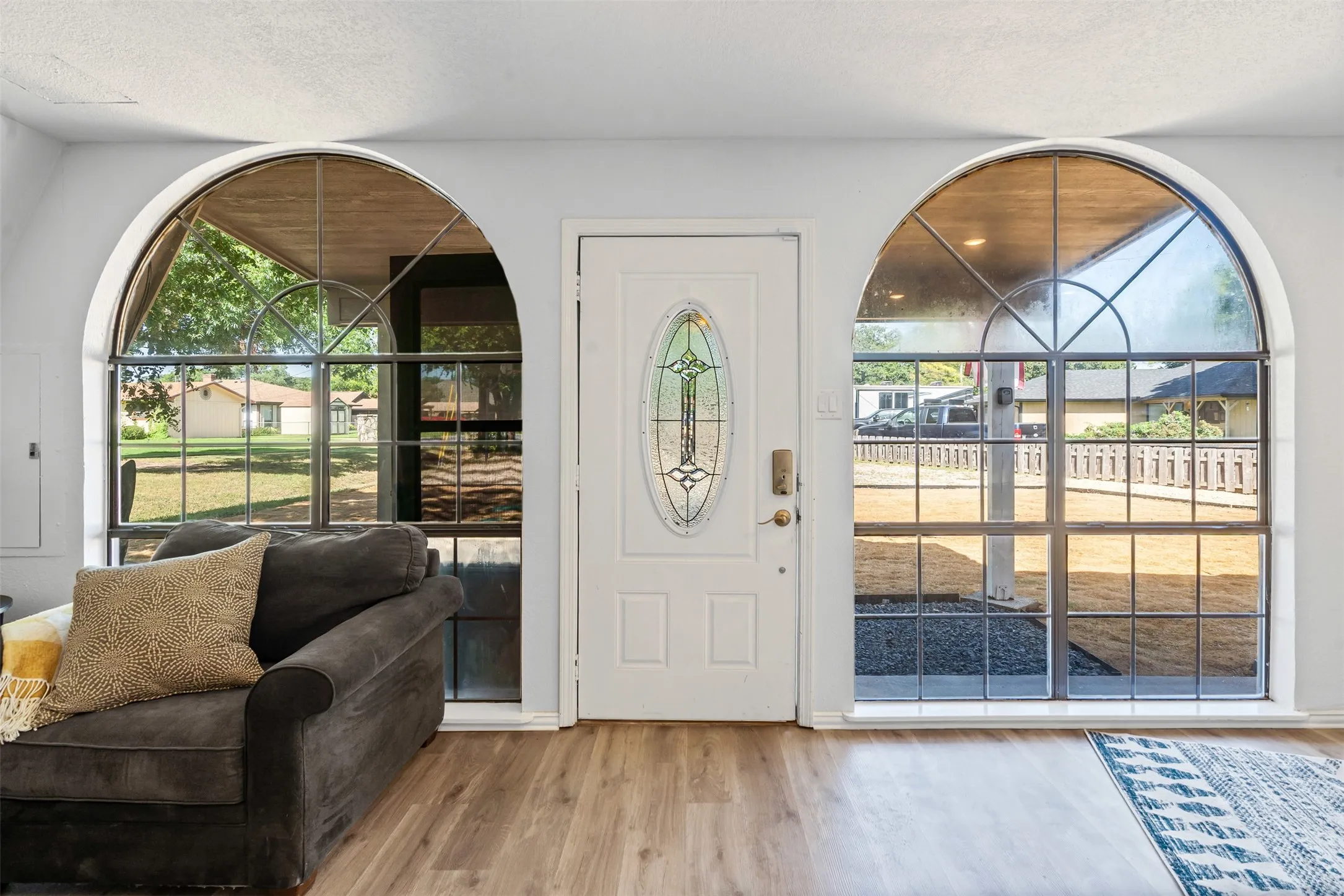 Entrance foyer featuring light wood-style flooring and a textured ceiling