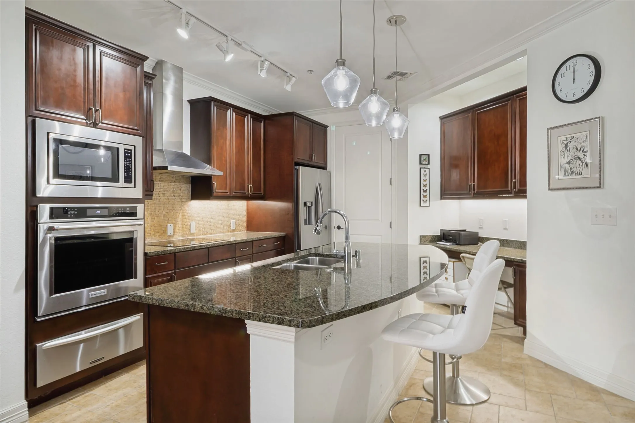 Beautifully updated kitchen with granite counters and stainless appliances..