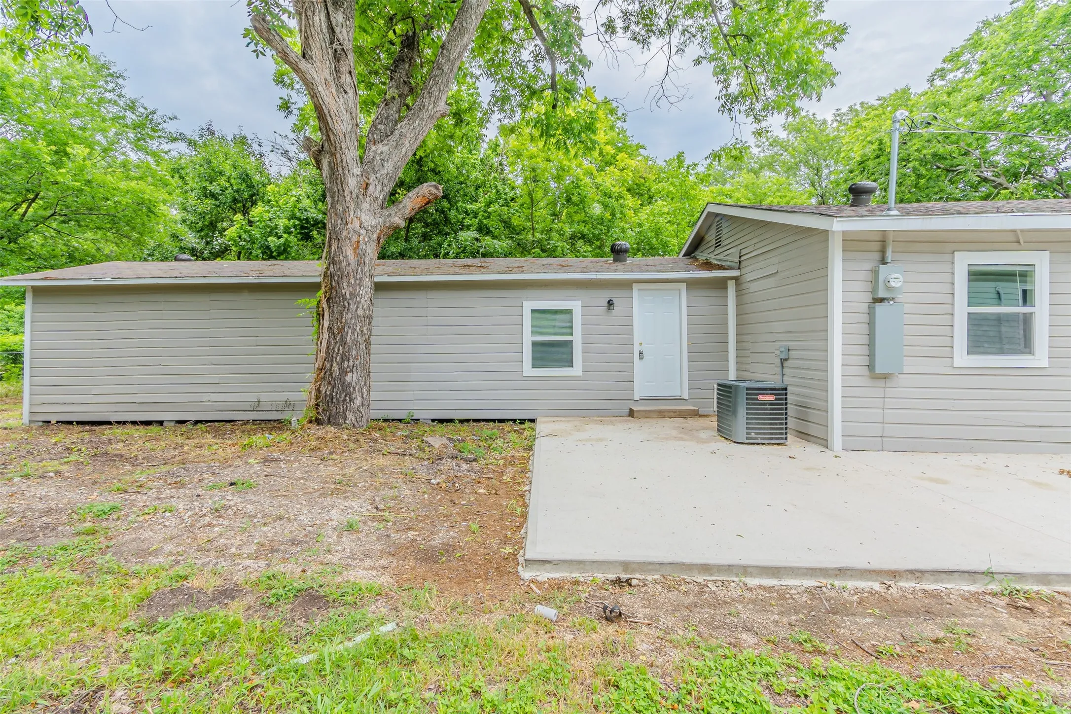 Back of property with a patio area