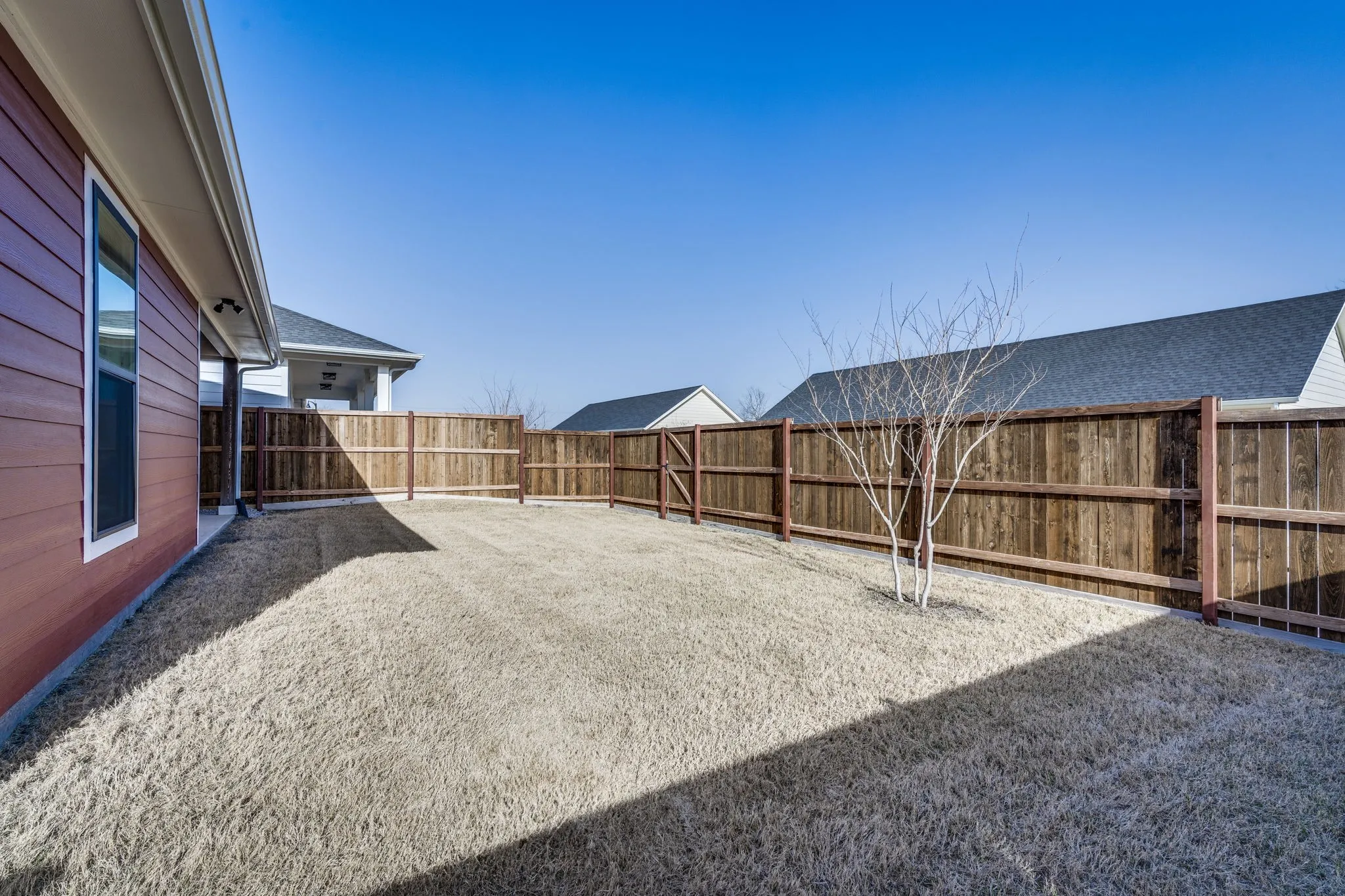 View of fenced backyard