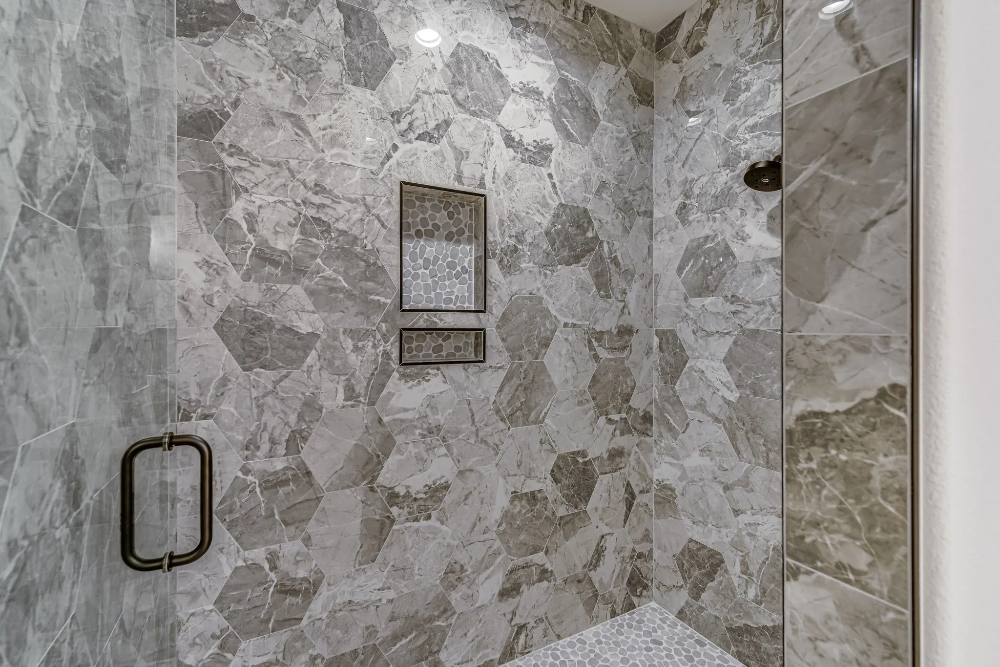 Bathroom featuring a marble finish shower
