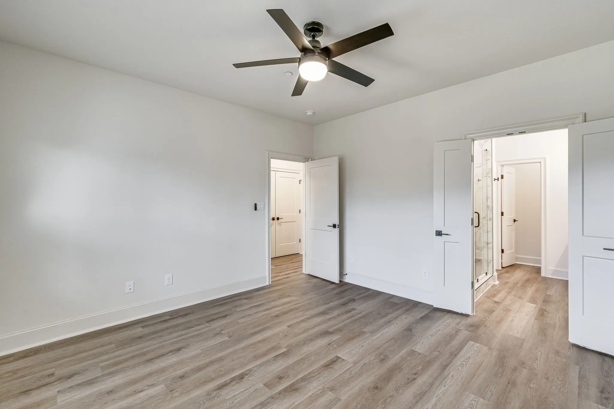 Unfurnished bedroom featuring light wood-style flooring and ceiling fan
