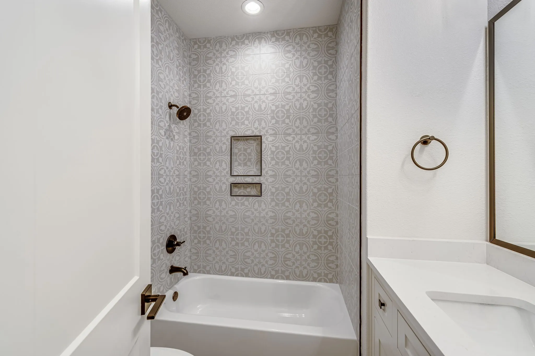 Bathroom featuring vanity and shower / tub combination