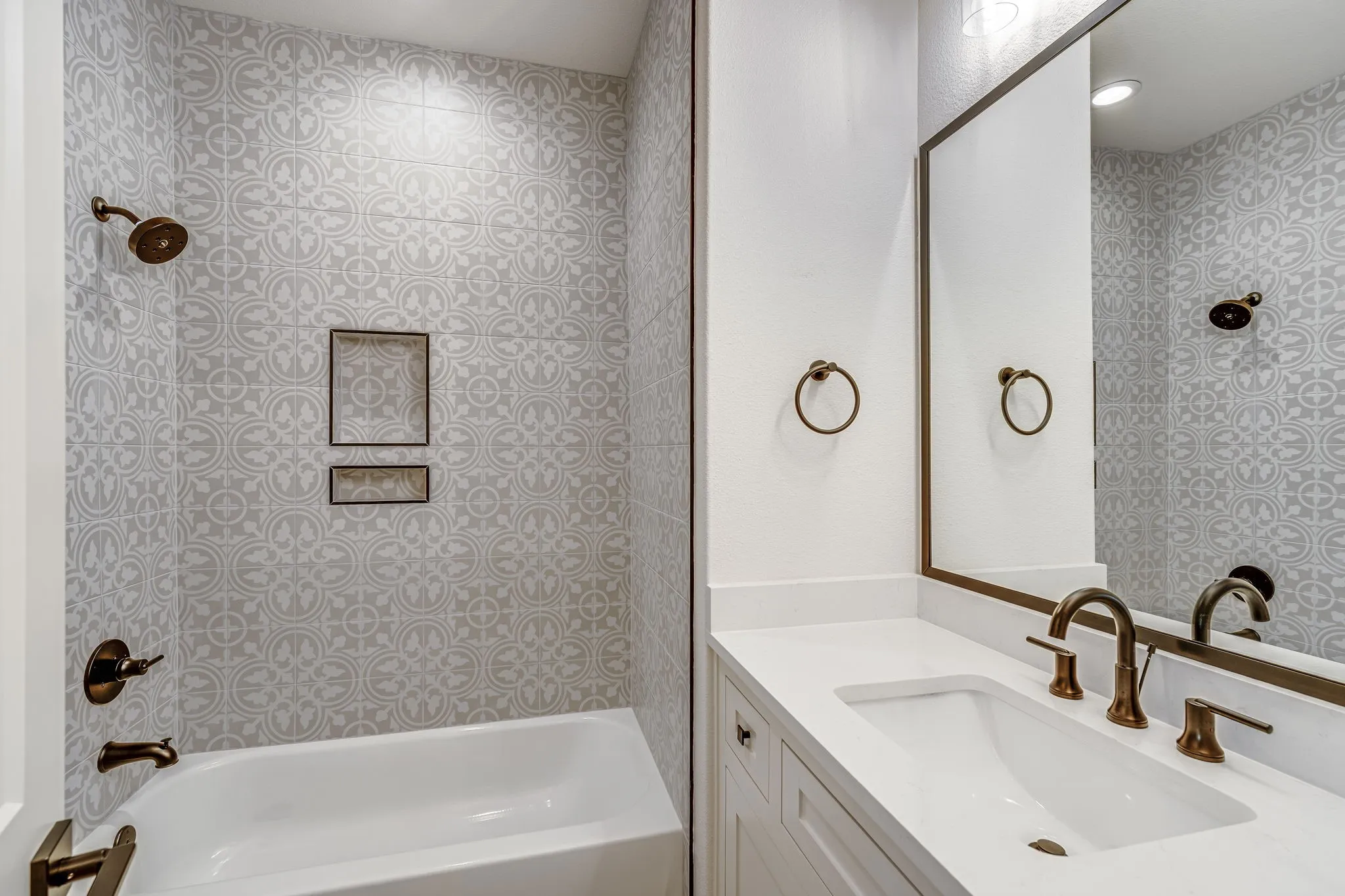 Bathroom featuring shower / tub combination and vanity