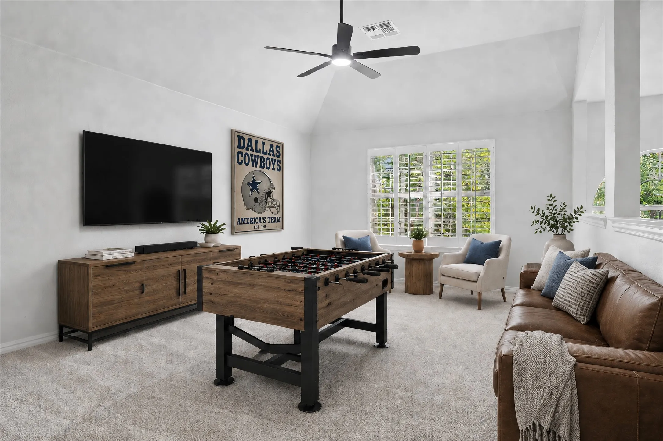 Upstairs game room with a walk in closet with shelves.