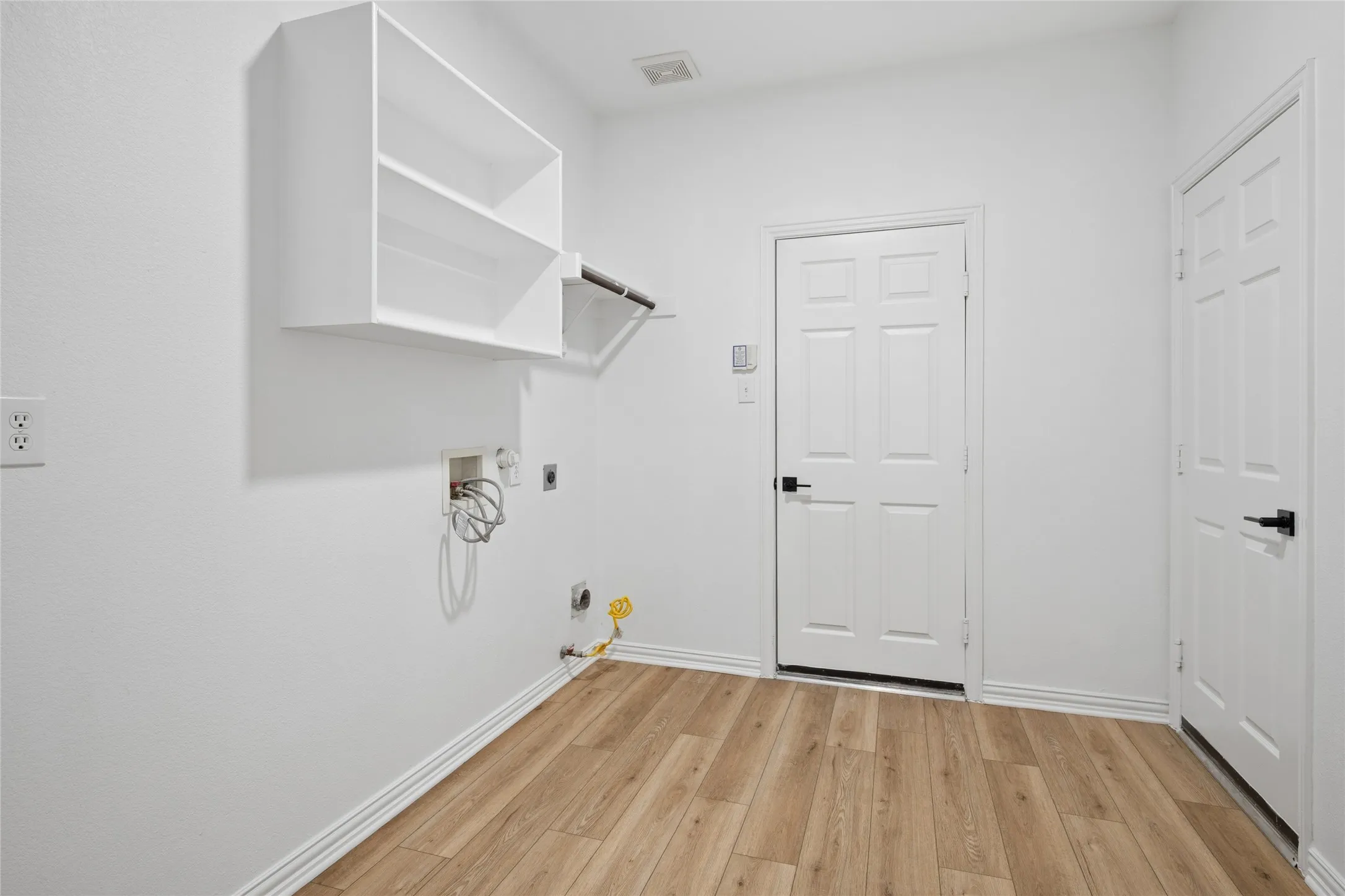 Very large laundry room with room for freezer.