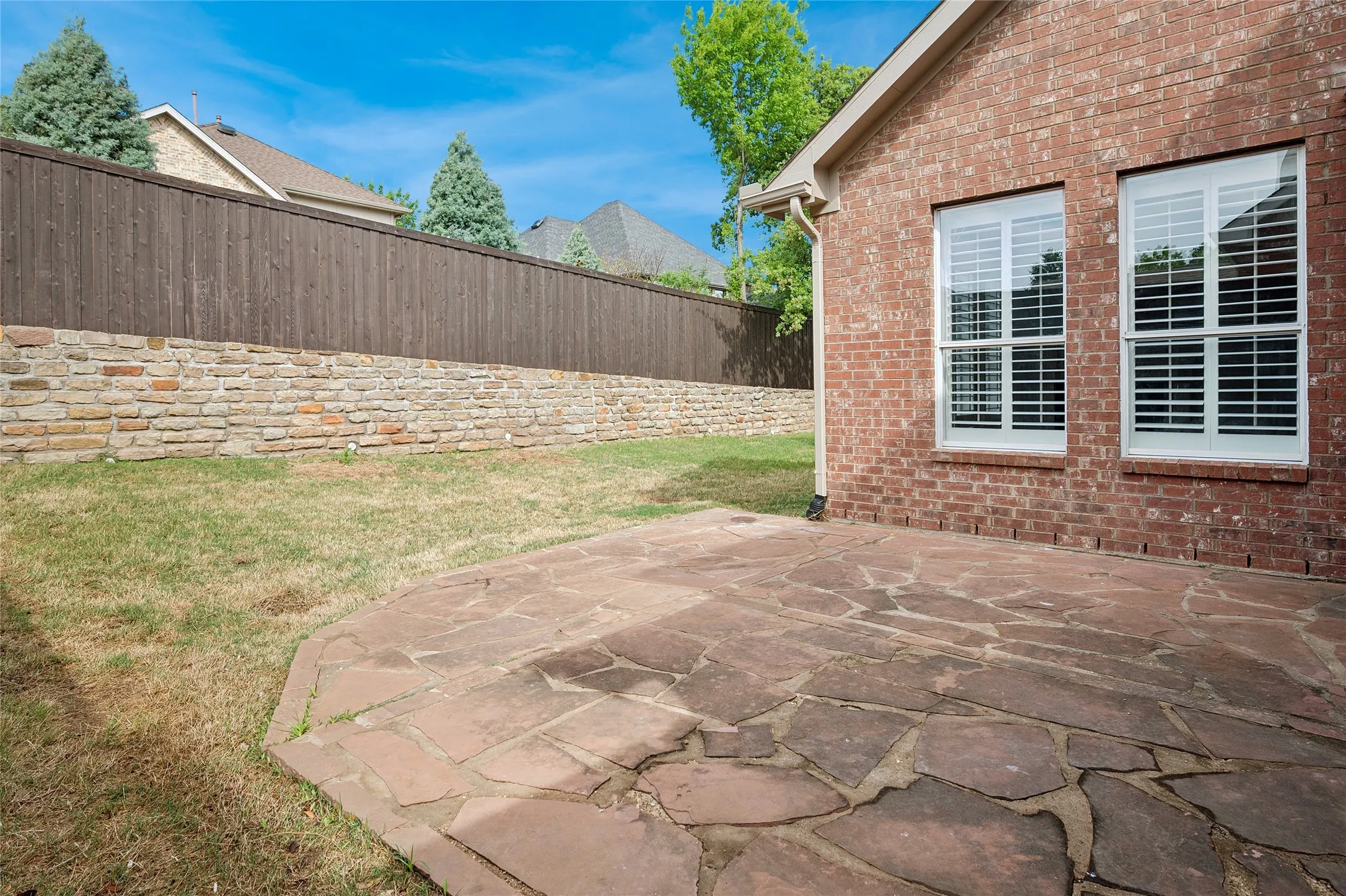 Private back yard with flagstone patio.