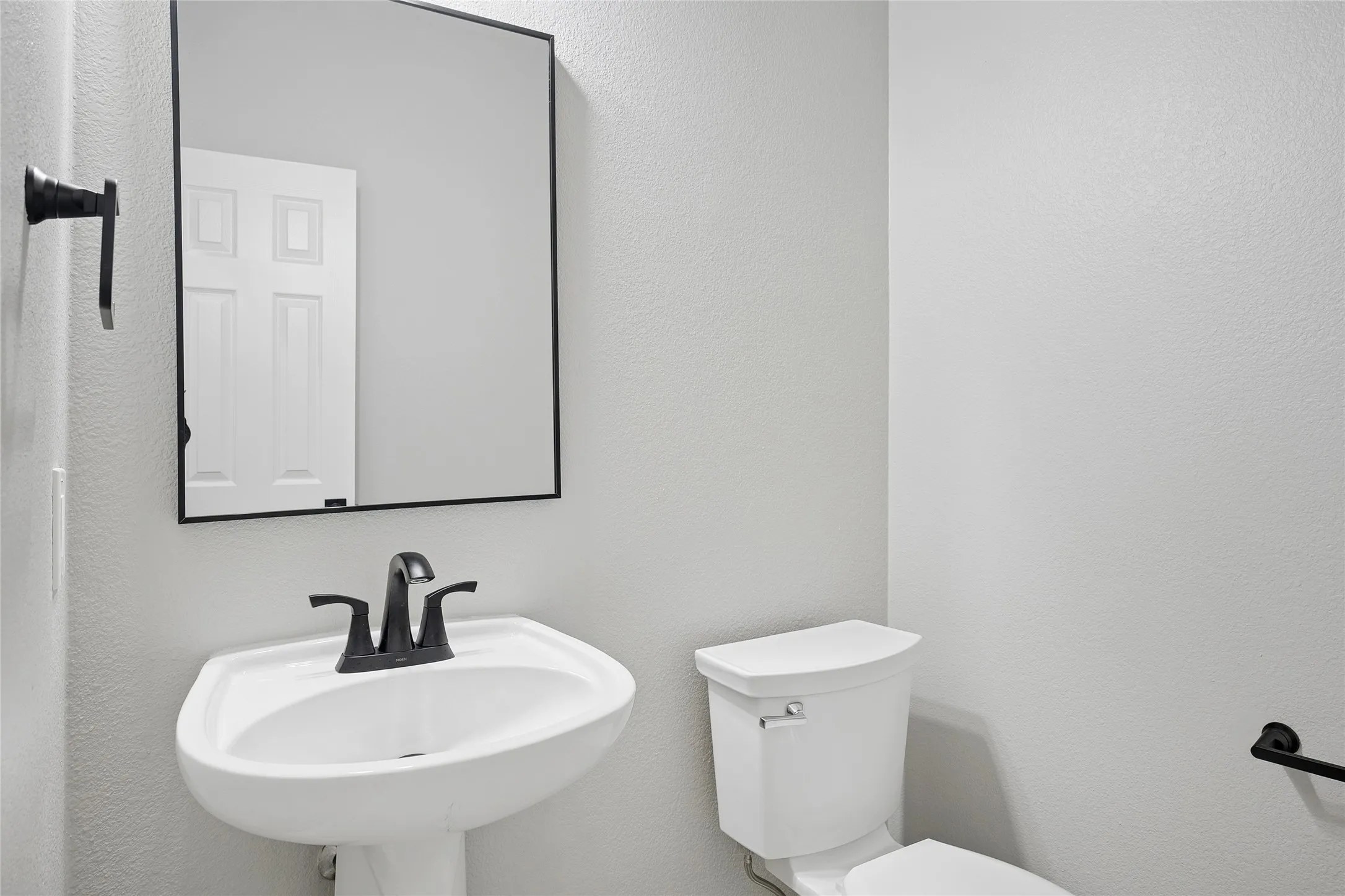 Downstairs powder bathroom.