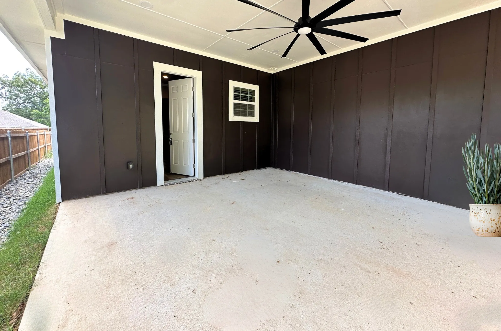 Oversized covered patio with resort fan