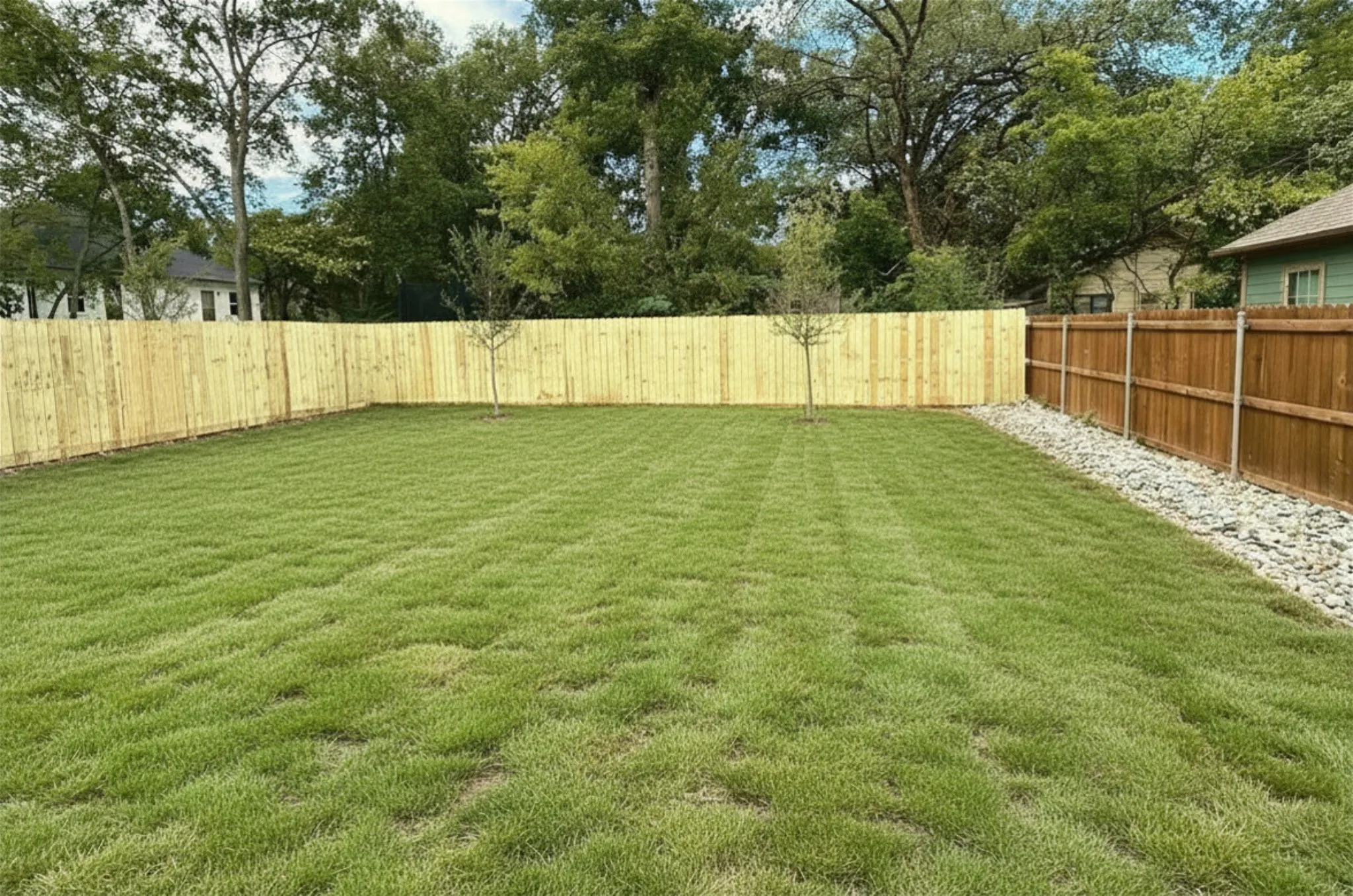 Large yard is fenced for privacy
