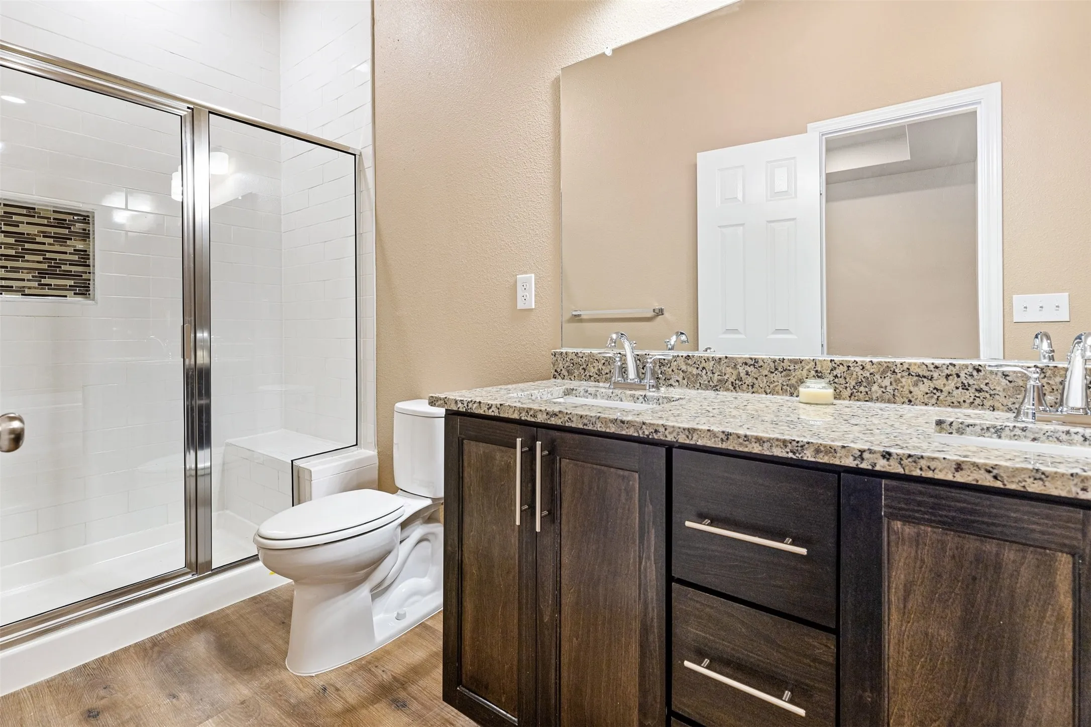 Primary bath has shower and separate tub