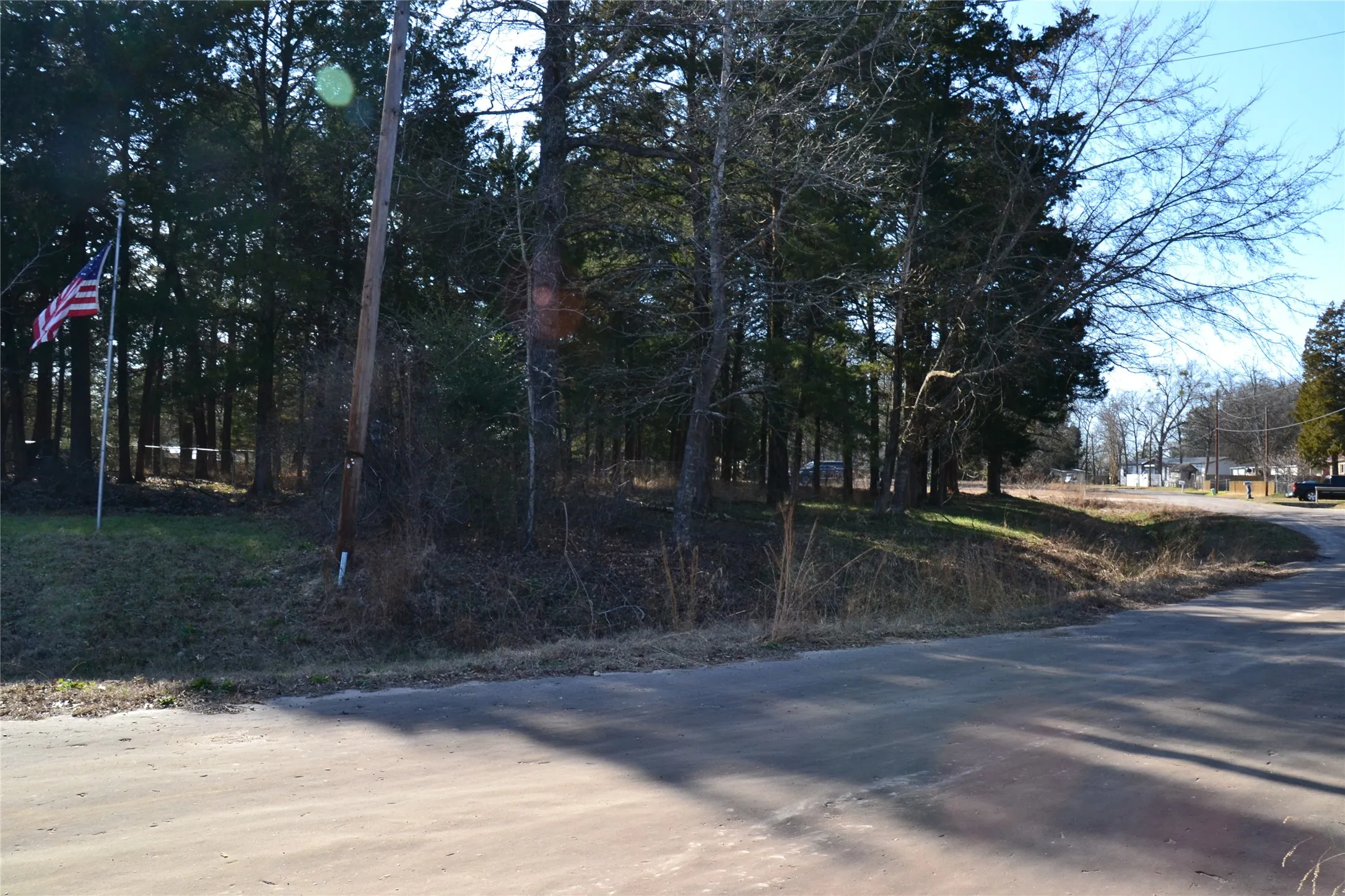 view of frontage road with Lot 1 on the left