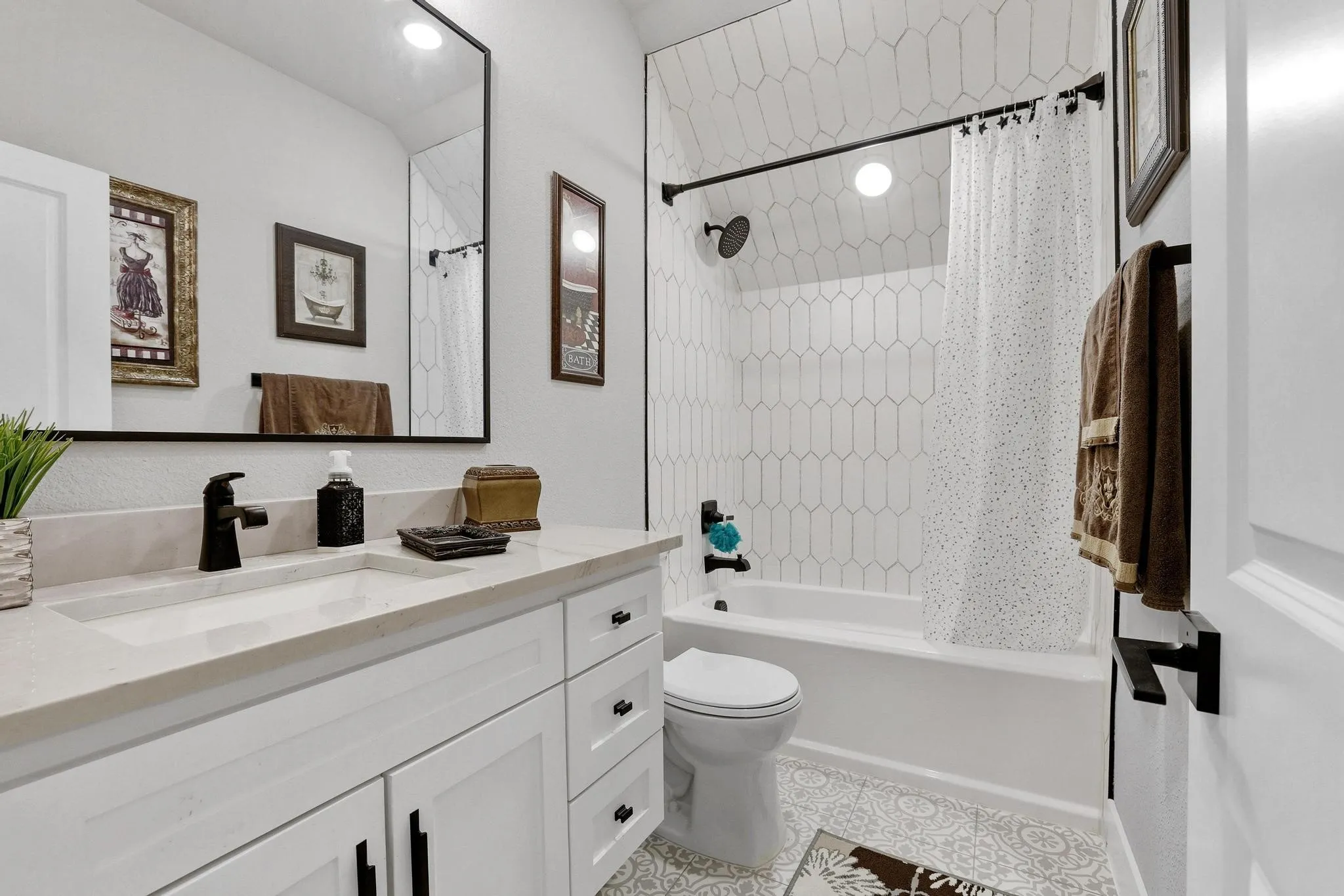 Bathroom featuring vanity and shower / tub combo