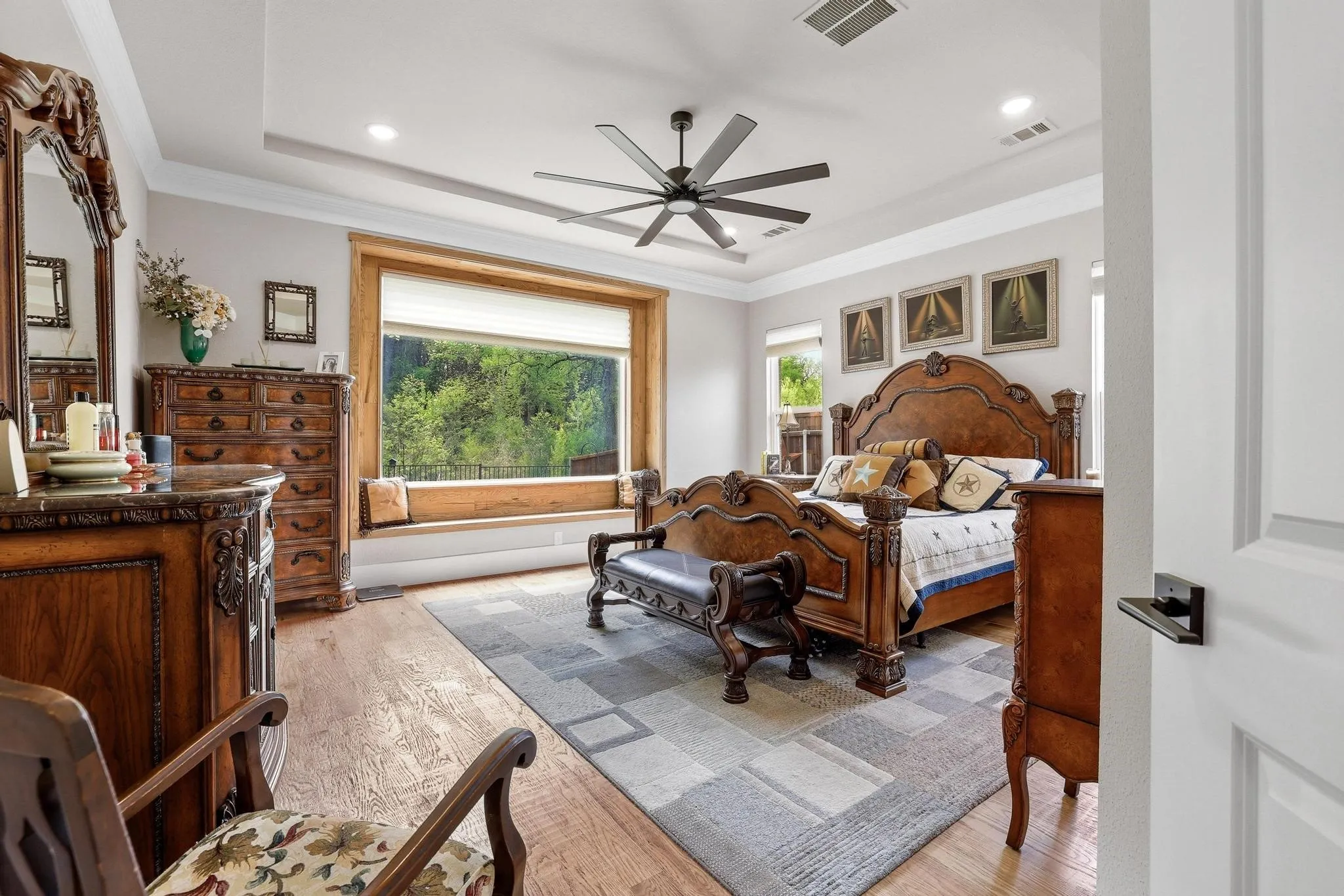 Bedroom with light wood-type flooring, multiple windows, ornamental molding, ceiling fan, and recessed lighting