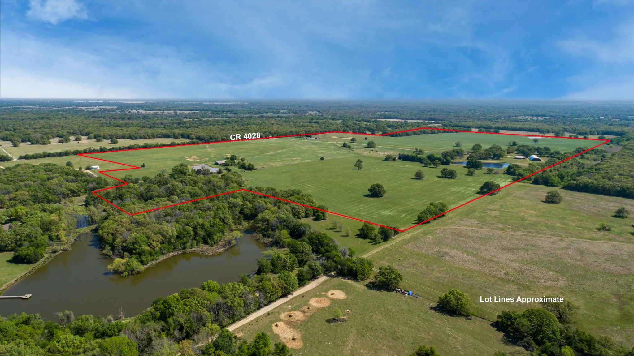 Overview of rural landscape with a large body of water and property boundaries highlighted