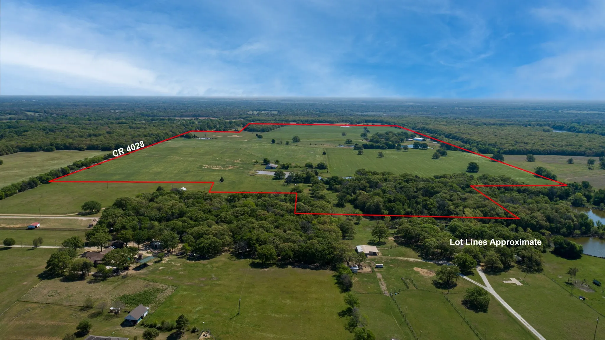 View of rural area with property parcel outlined and agricultural land