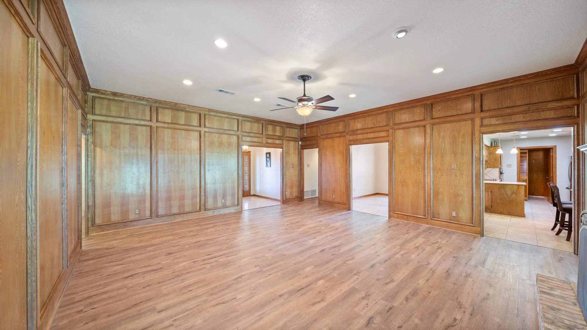 Living room with view of kitchen and formal dining