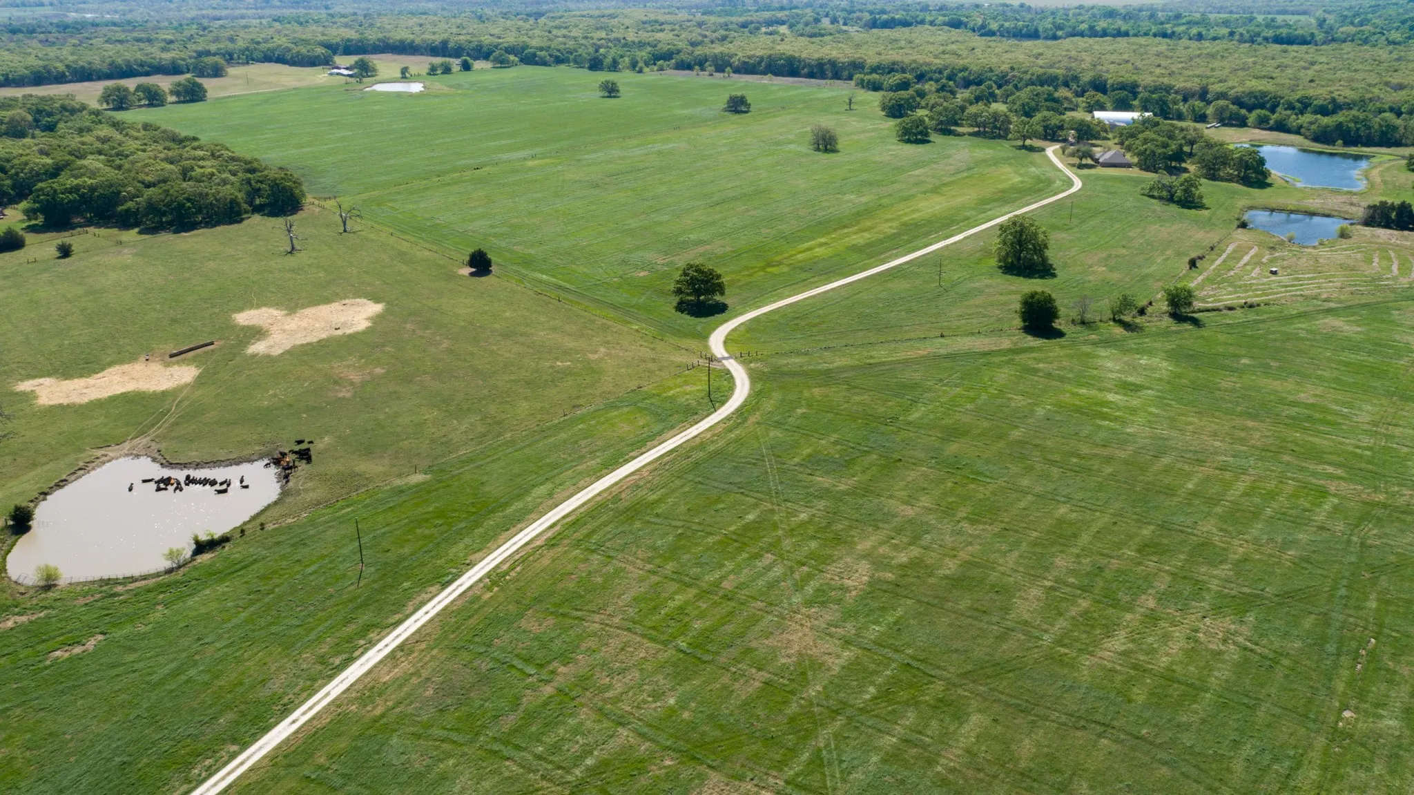Aerial view of a nearby body of water, home sets back for privacy