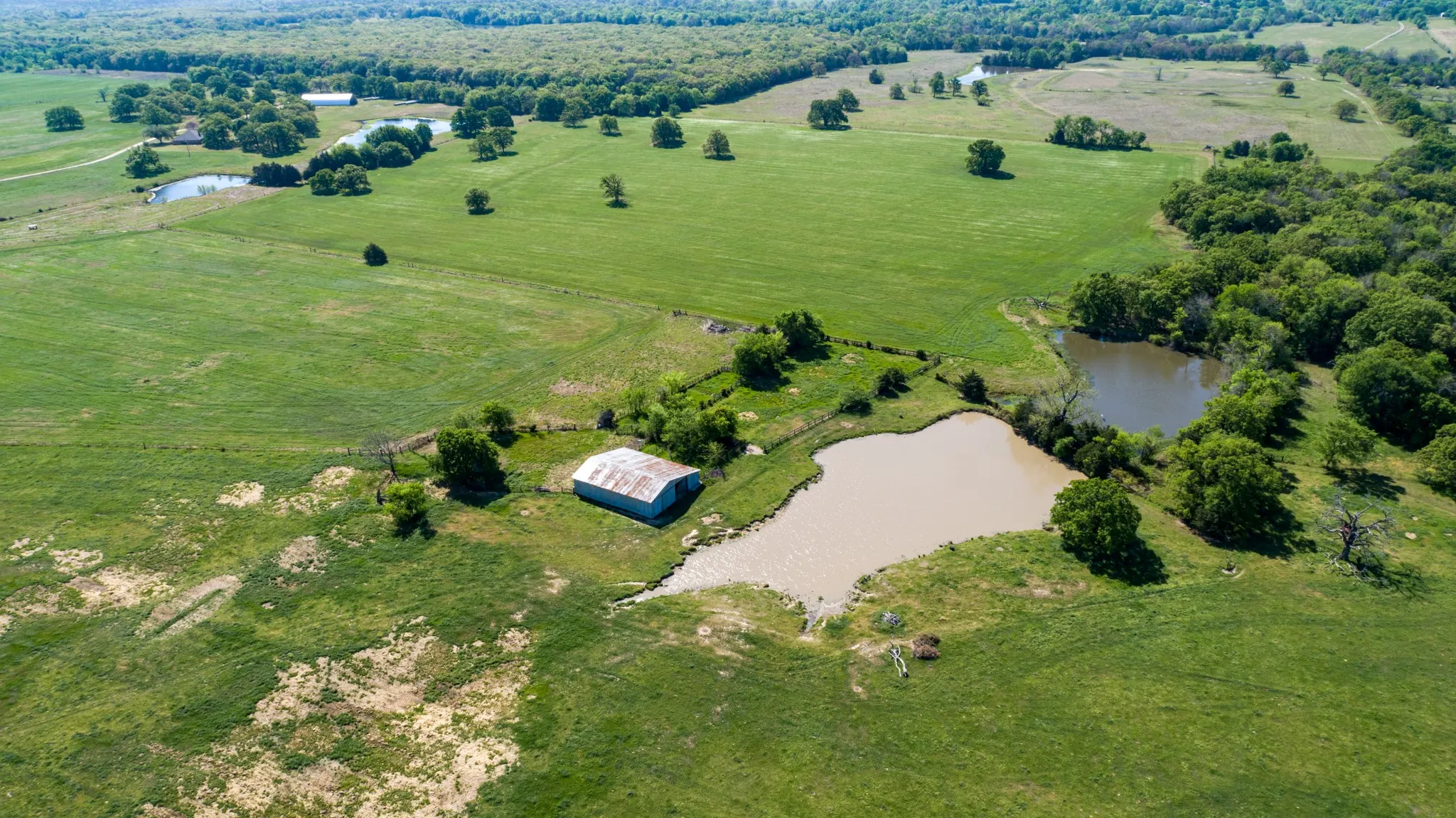 Aerial view of sparsely populated area with a nearby body of water