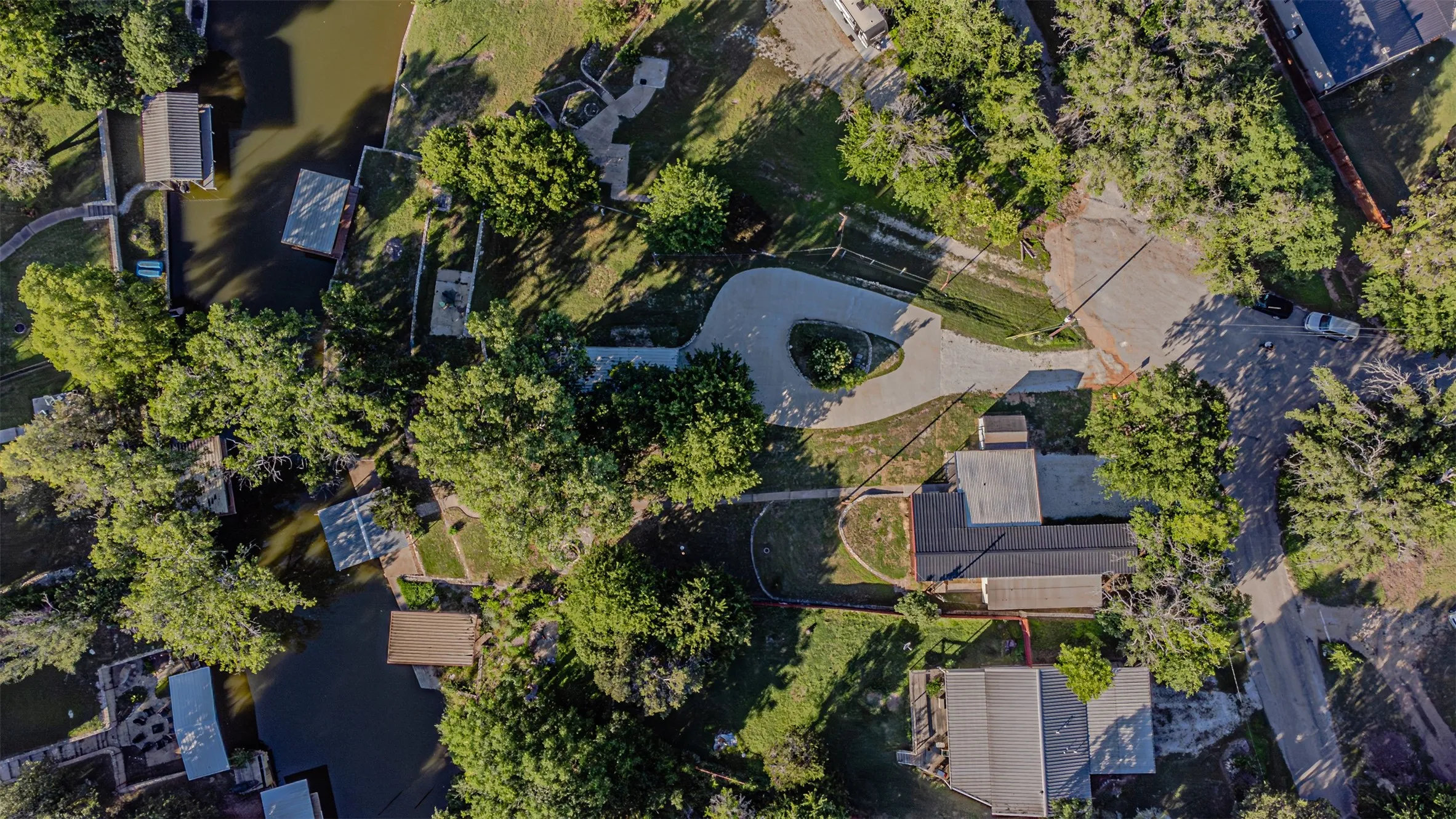 Aerial property overview showcasing waterfront access with multiple private docks