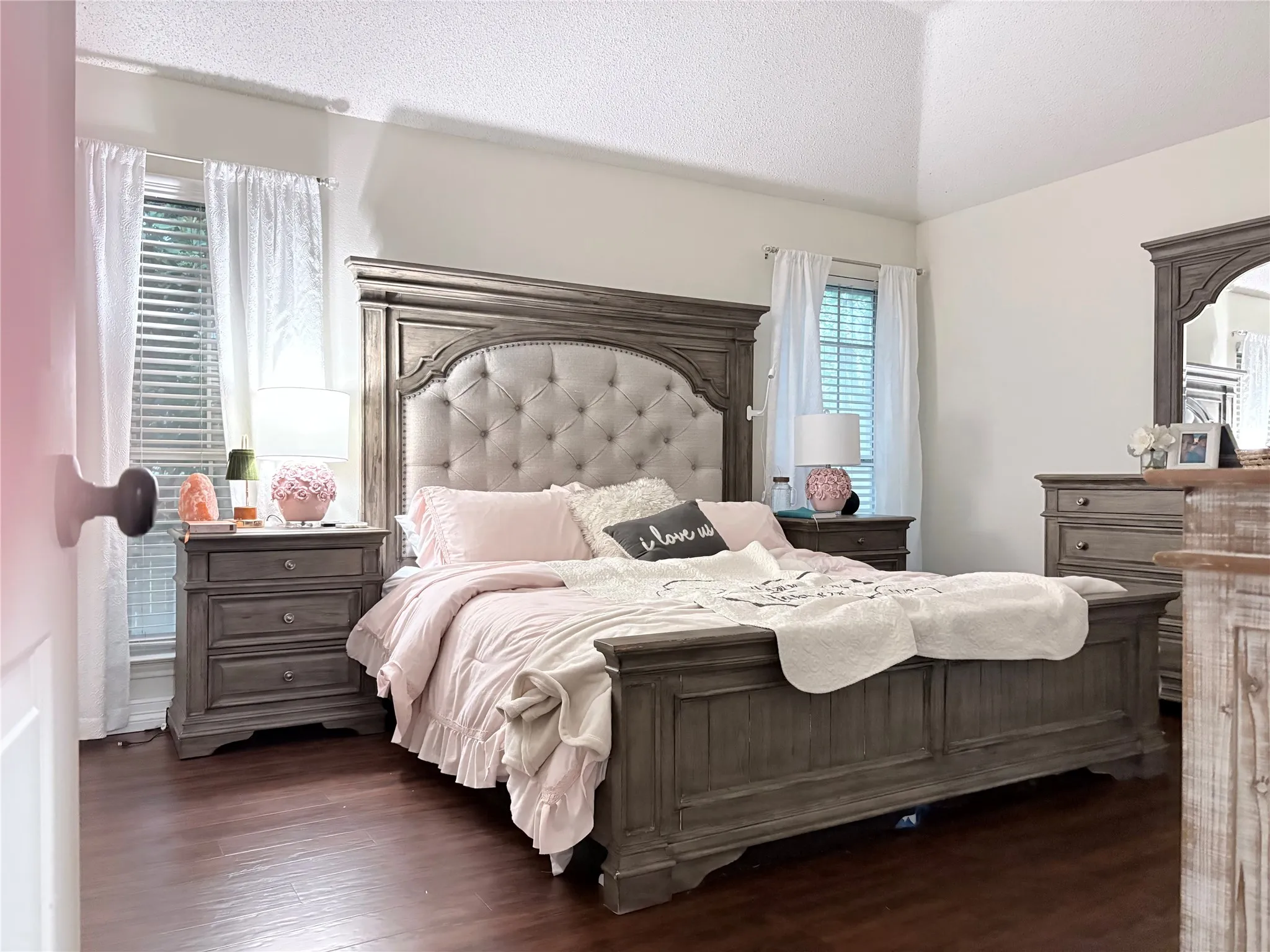 Bedroom with dark wood-style flooring