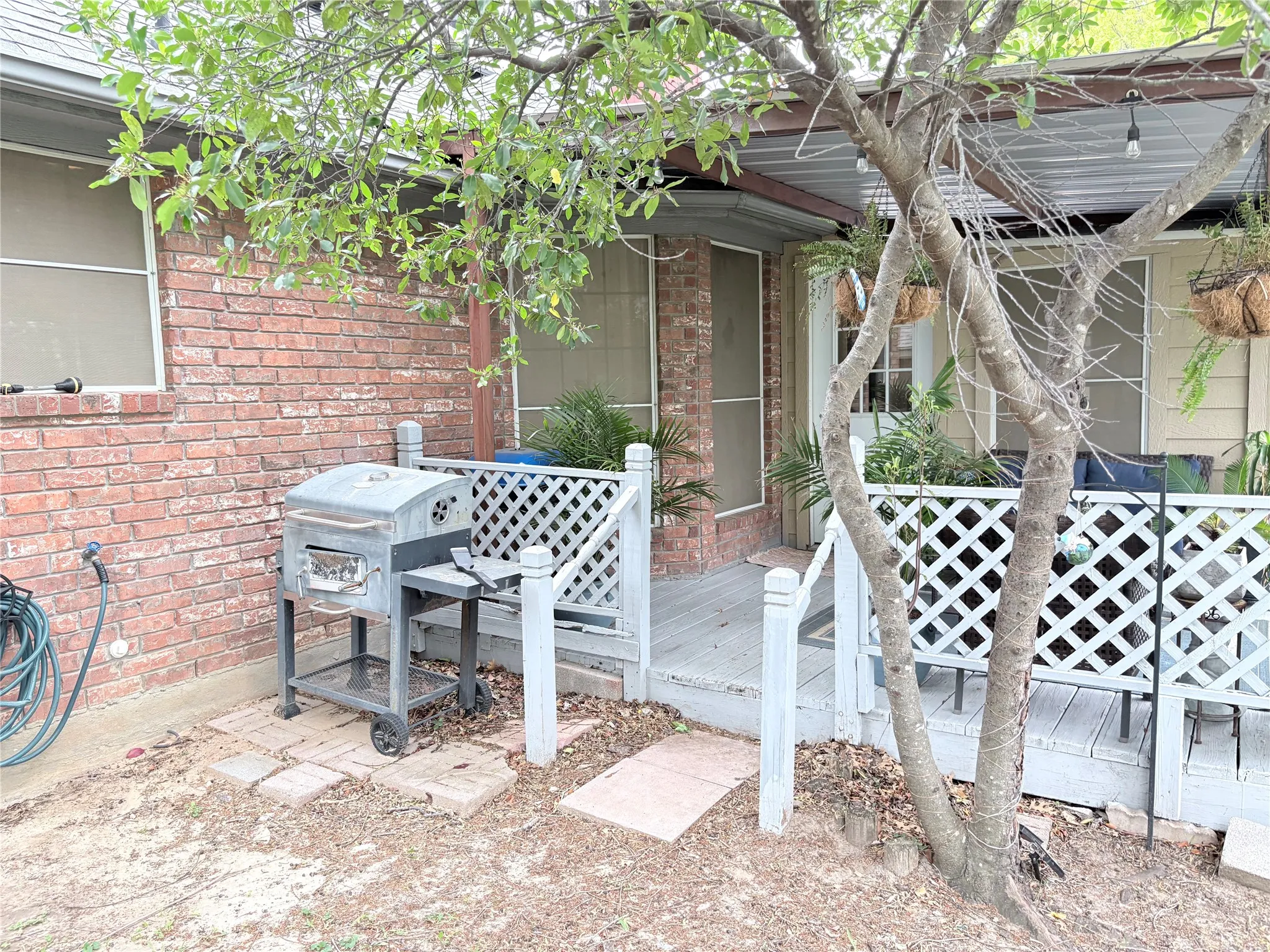 View of patio / terrace with a wooden deck and area for grilling