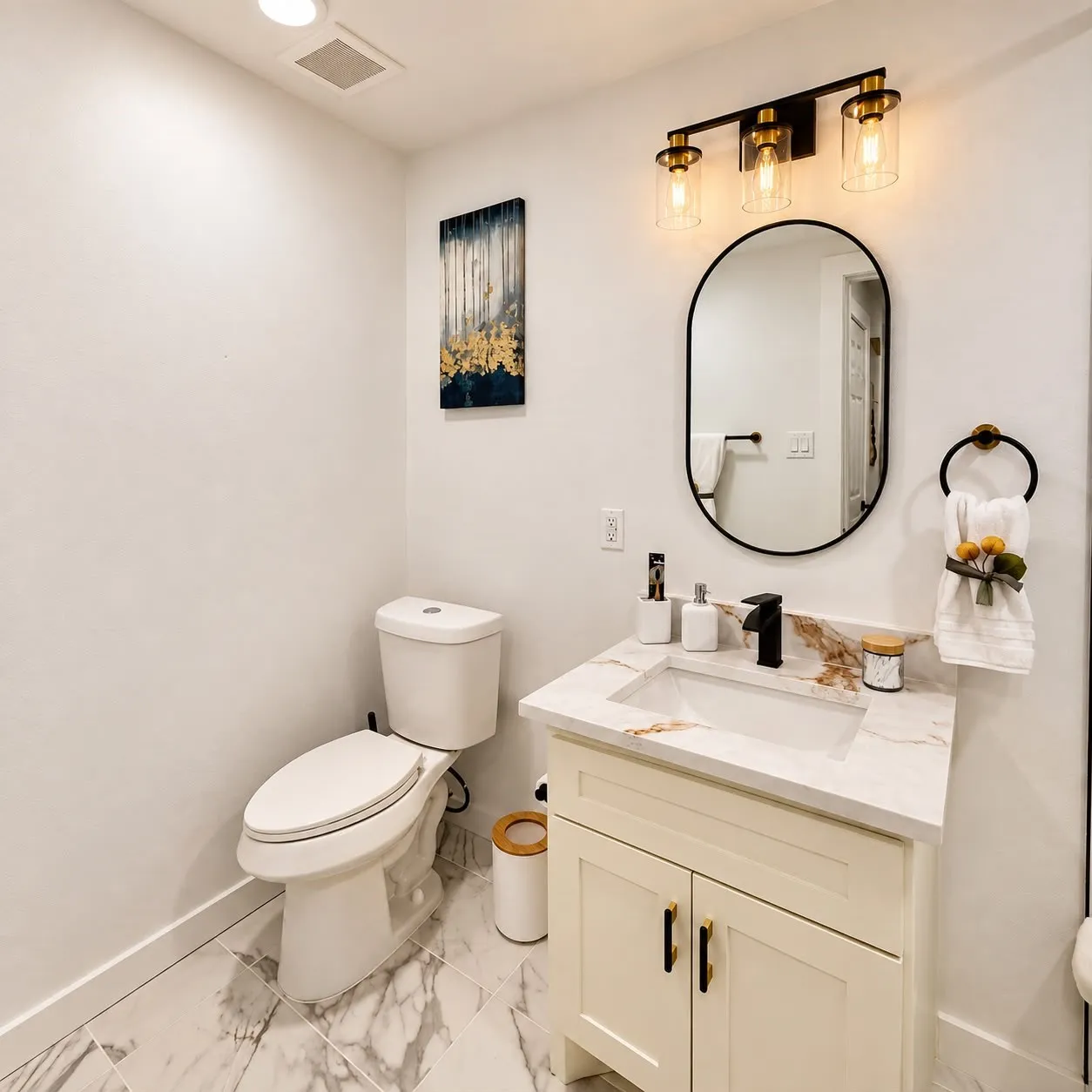 White vanity with a single sink, black faucet, and stone-finish countertop