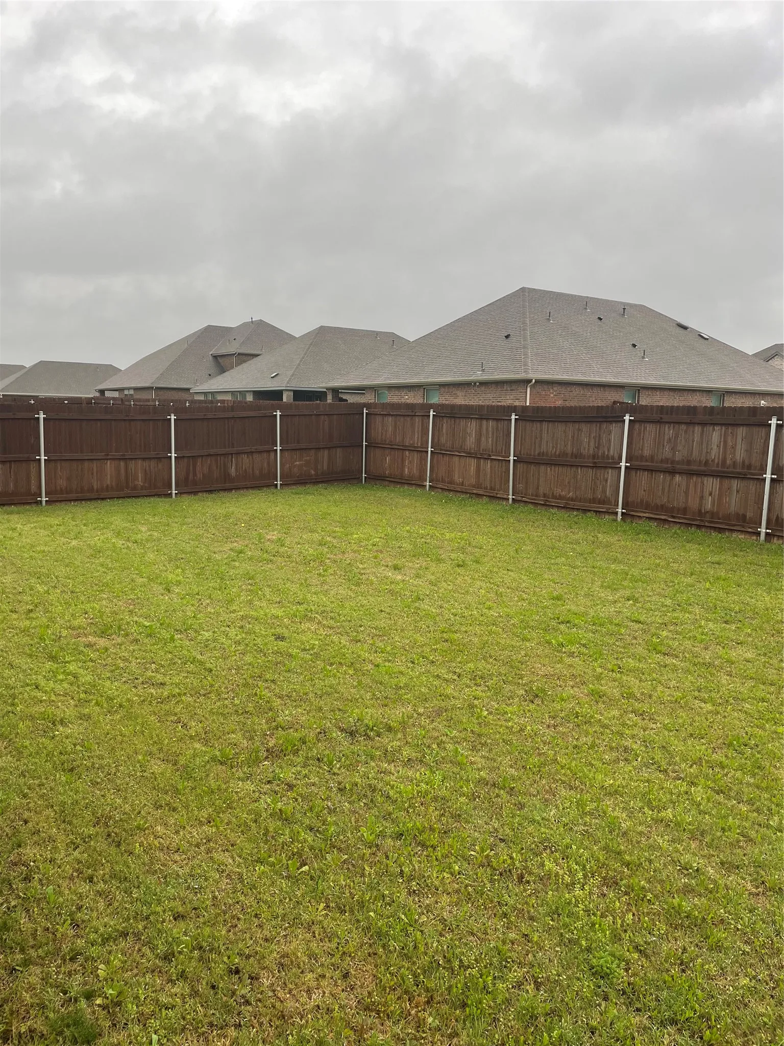 View of fenced backyard