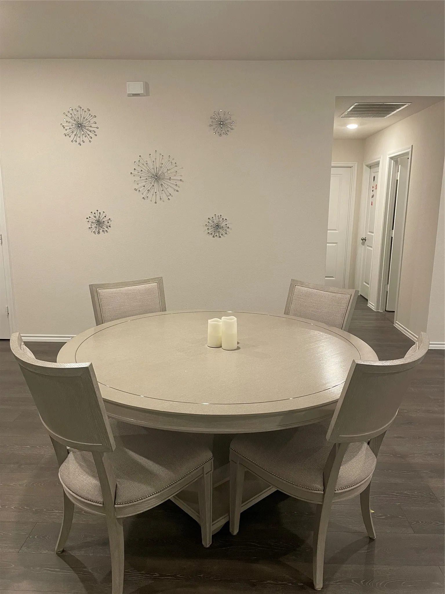 Dining area with dark wood finished floors and baseboards