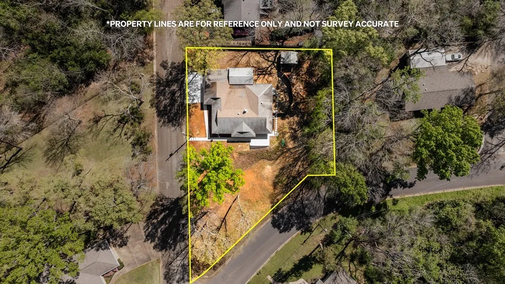Aerial view of property and surrounding area featuring property boundaries highlighted