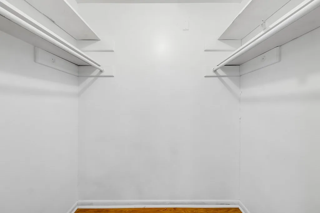 Walk in closet featuring light wood-type flooring