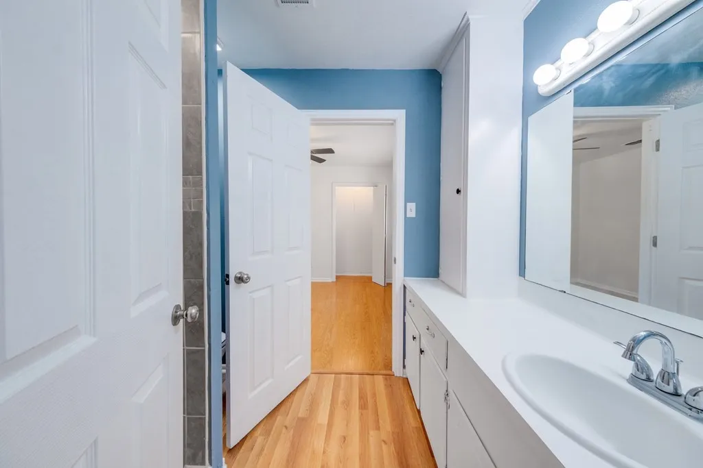 Bathroom with vanity and light wood-type flooring