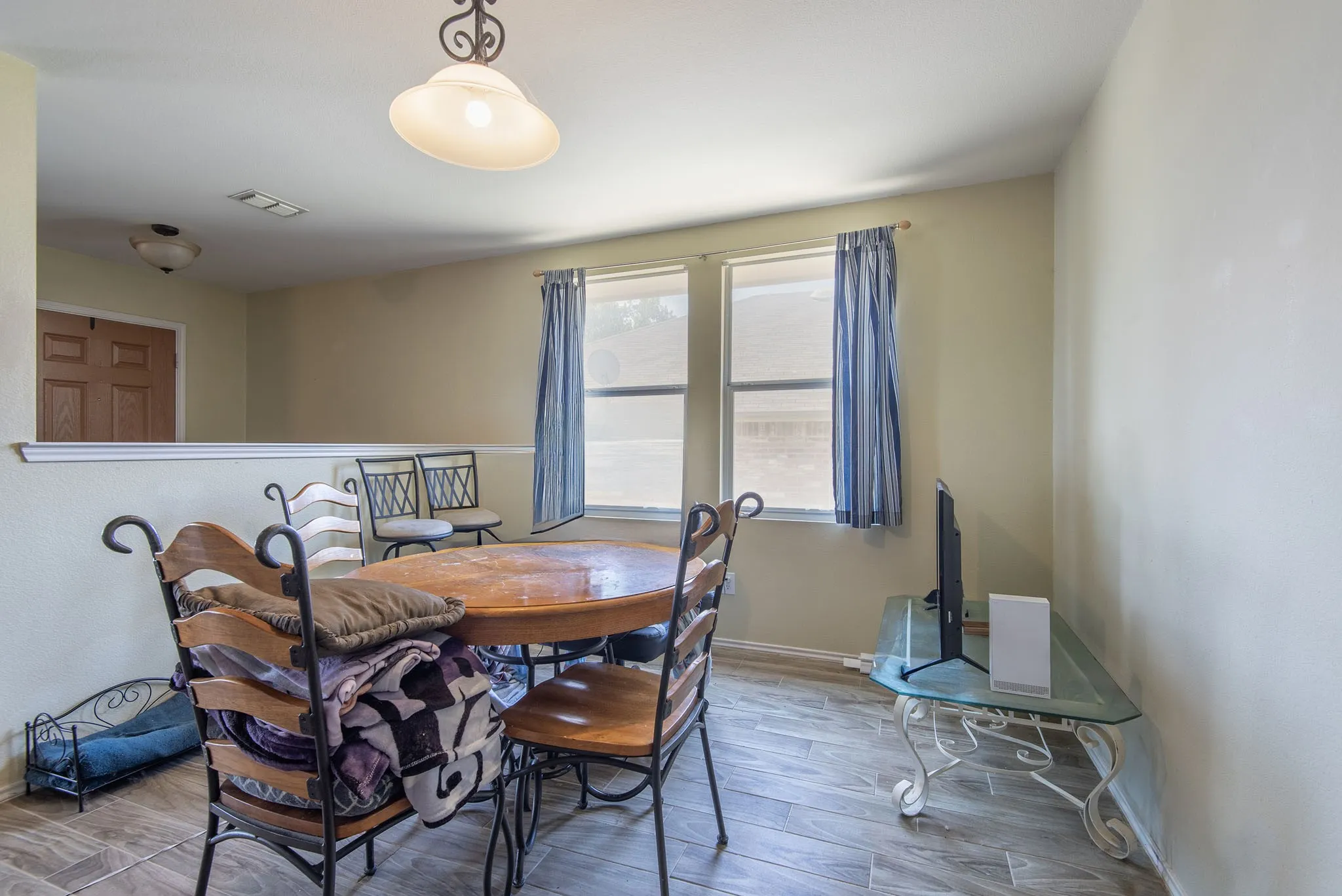 Dining room featuring wood finished floors and baseboards