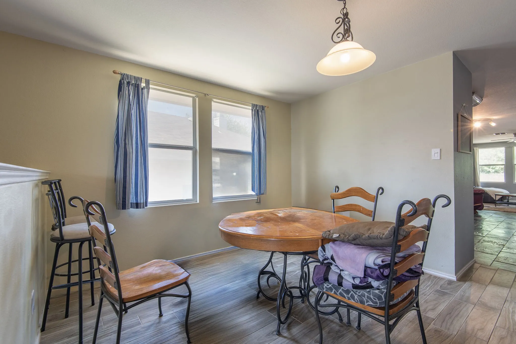 Dining room featuring wood finished floors and baseboards