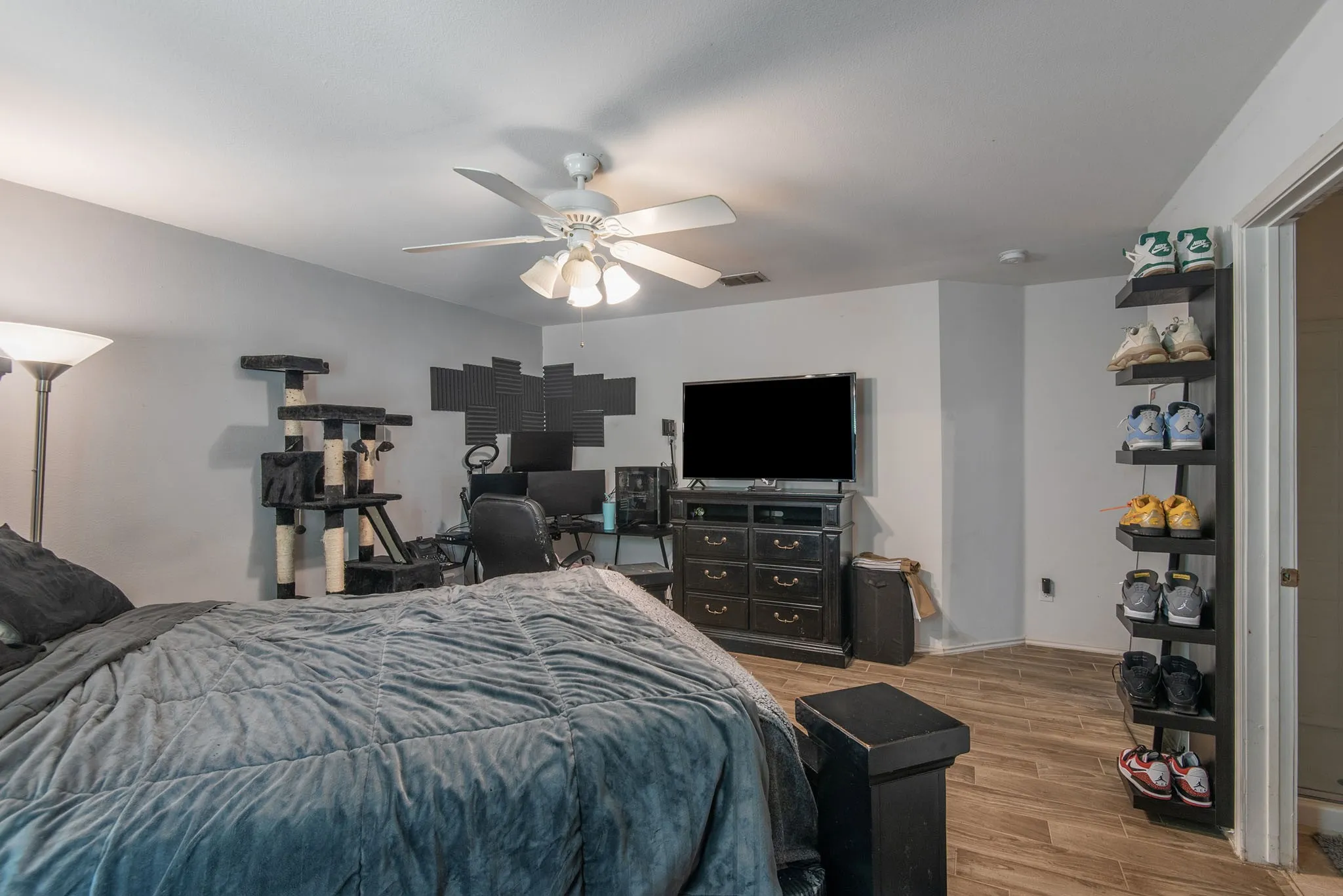 Bedroom with wood finished floors and a ceiling fan