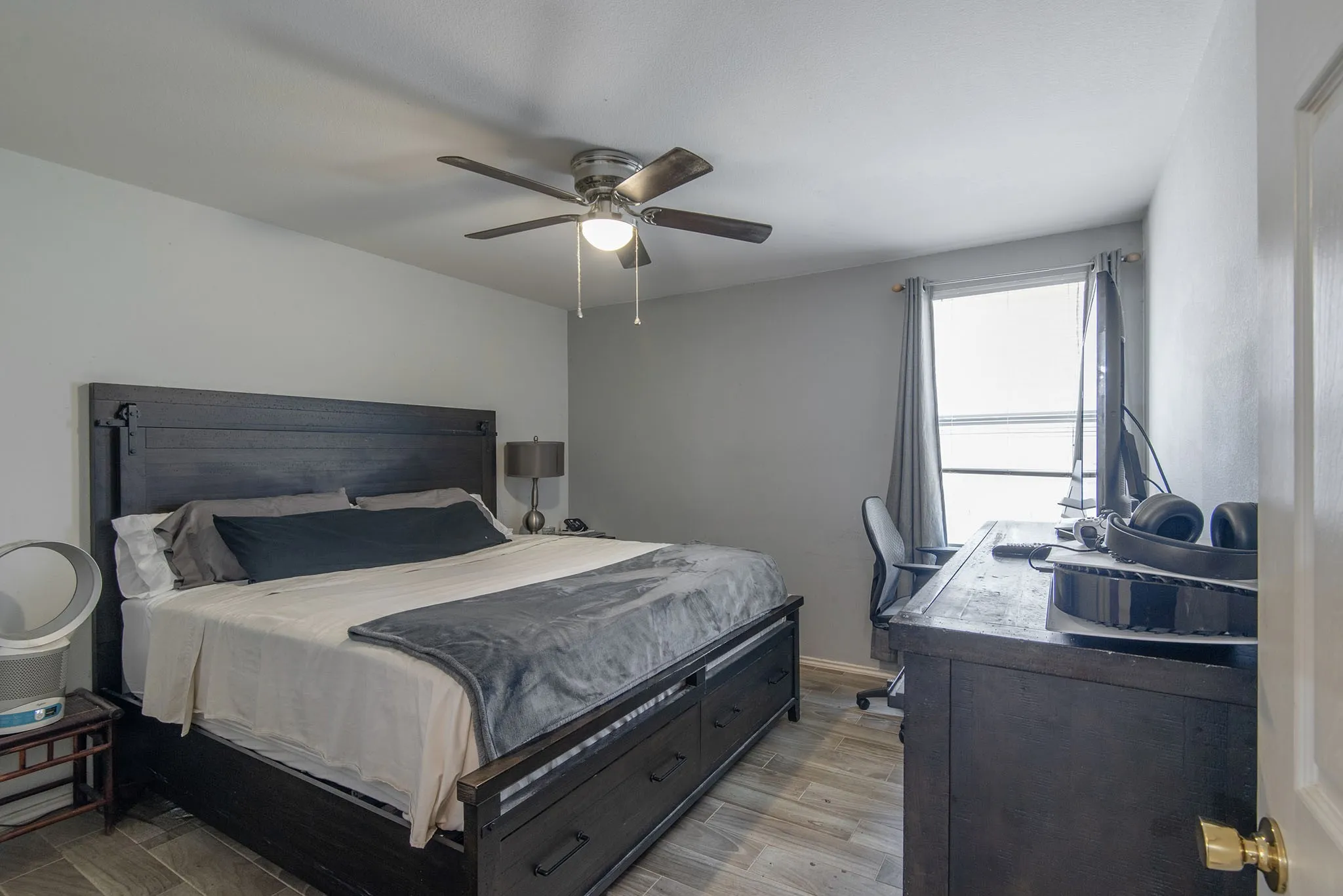Bedroom featuring light wood finished floors and ceiling fan