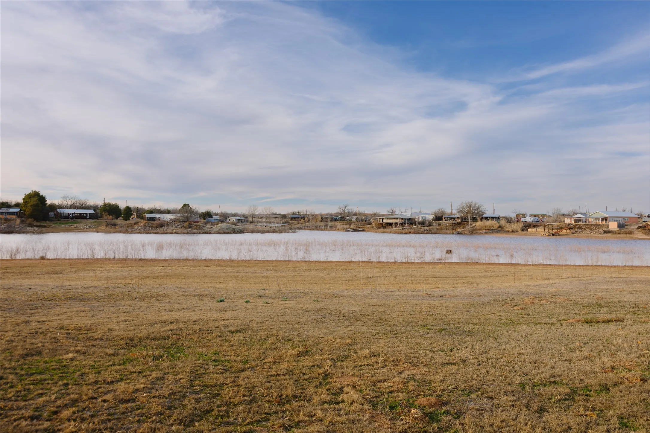View of grassy yard featuring a water view